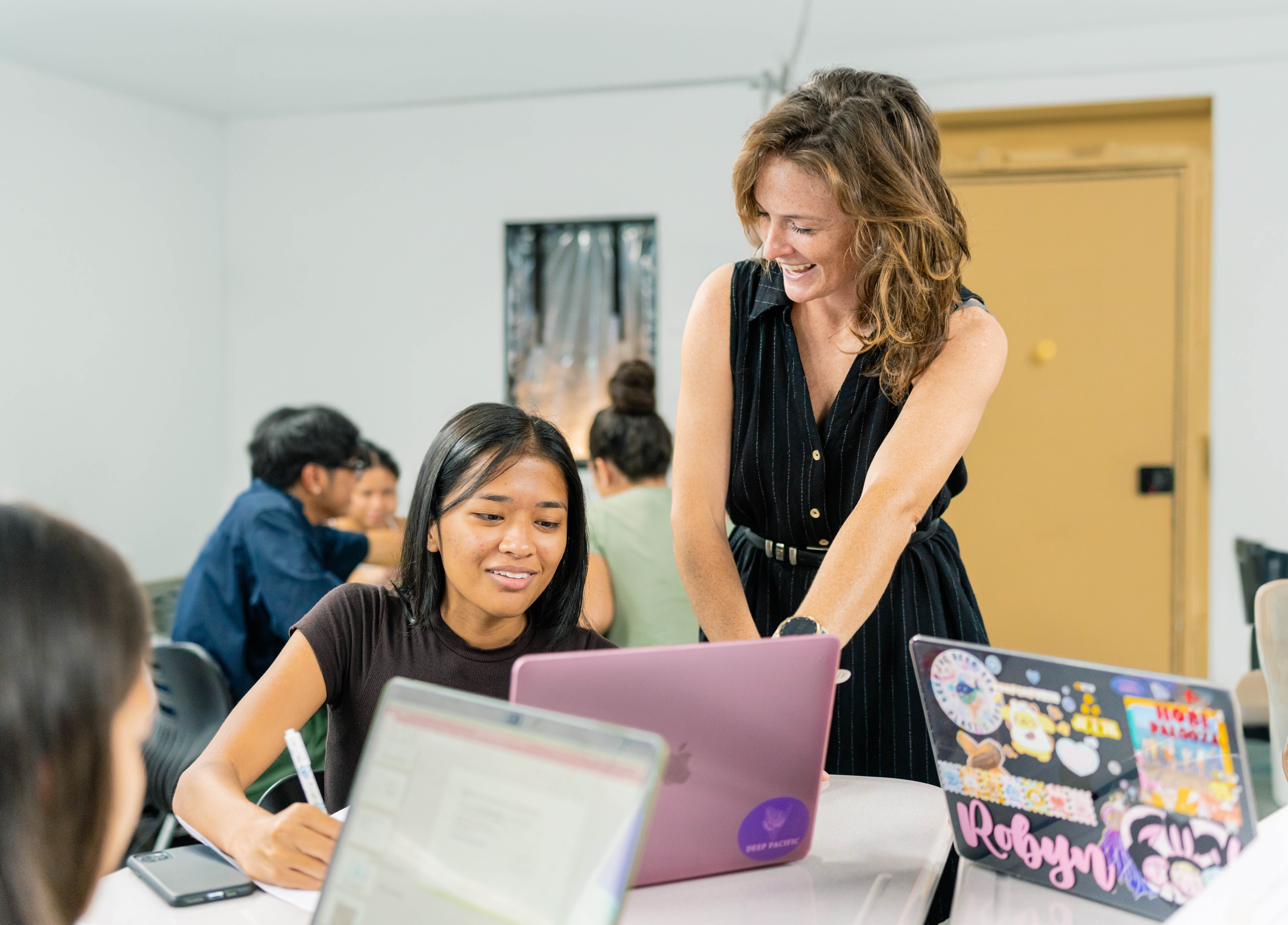 NMC Natural Resource Management Program Coordinator Kelsey McClellan with one of her students during a class.