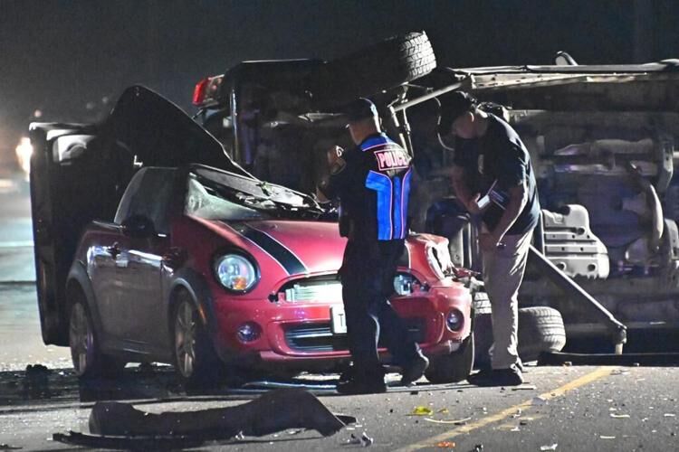 A red Mini Cooper and overturned Toyota 4 Runner being investigated by the Guam Police Department after a three car crash on Route 10 in Mangilao near Uncle Cho's Mart on Thursday evening. 