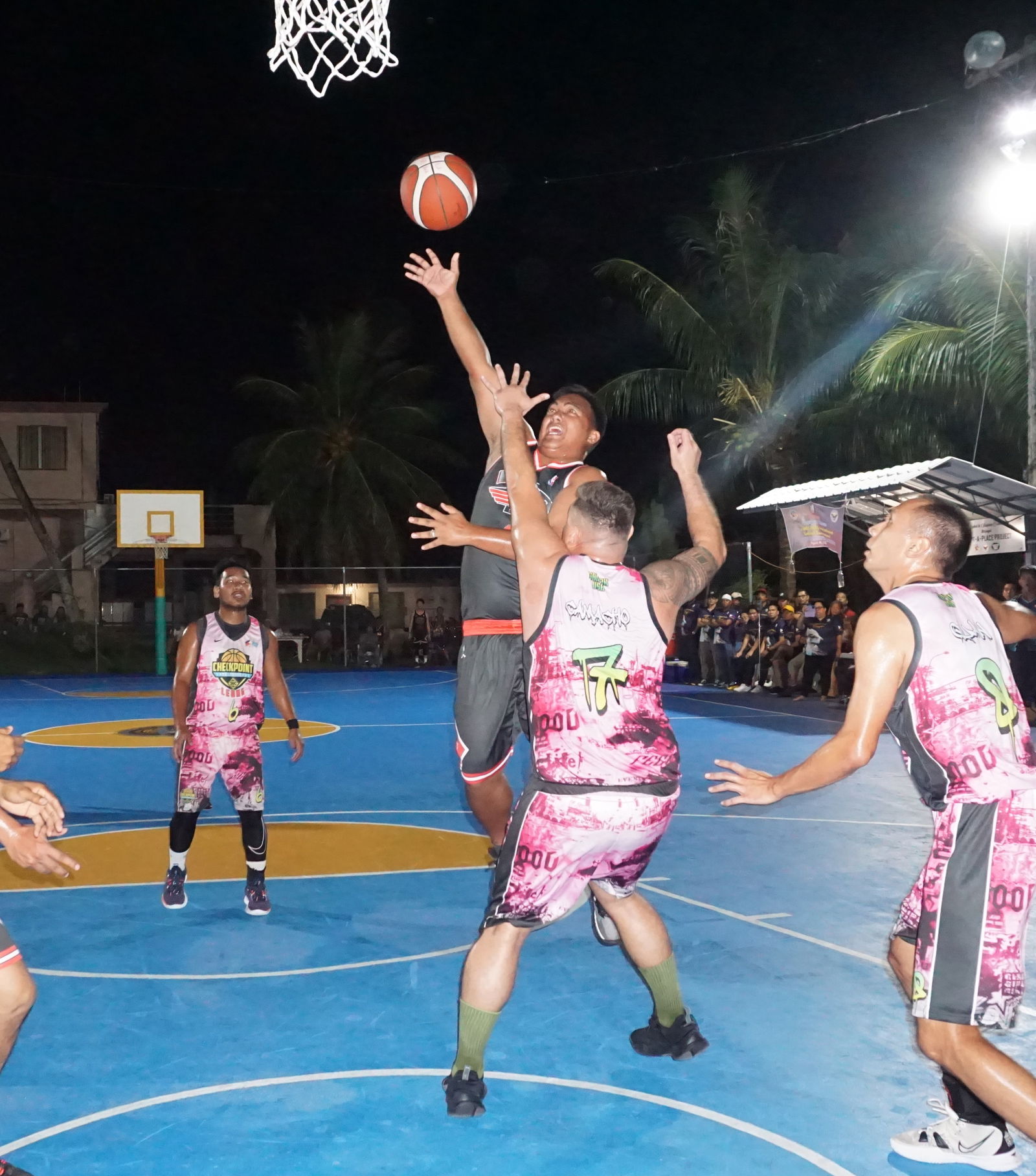 Easy Riders' Raymond Velasco gets fouled as he goes up for the shot.