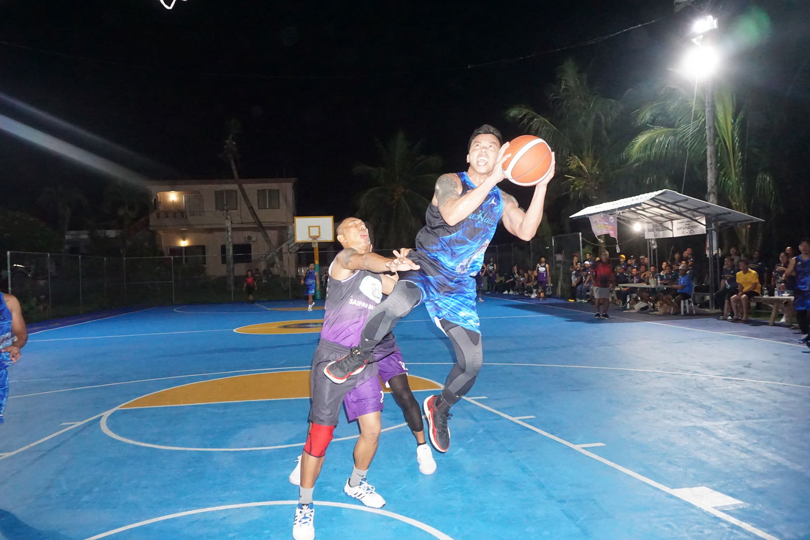 Blue Haus' Marlon De Dios gets fouled as he goes up for the off-balanced shot.