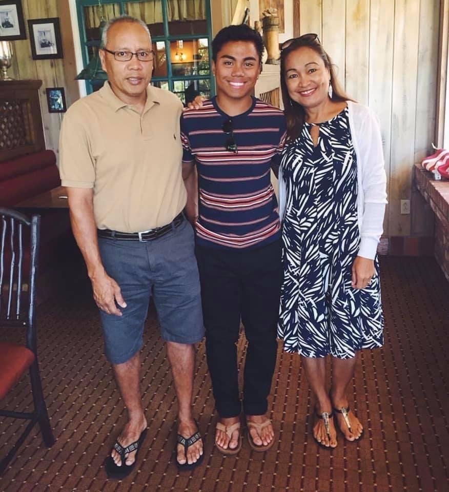 Joshua Villagomez poses with his parents, Pratick Cabrera and Susan Castro Cabrera.