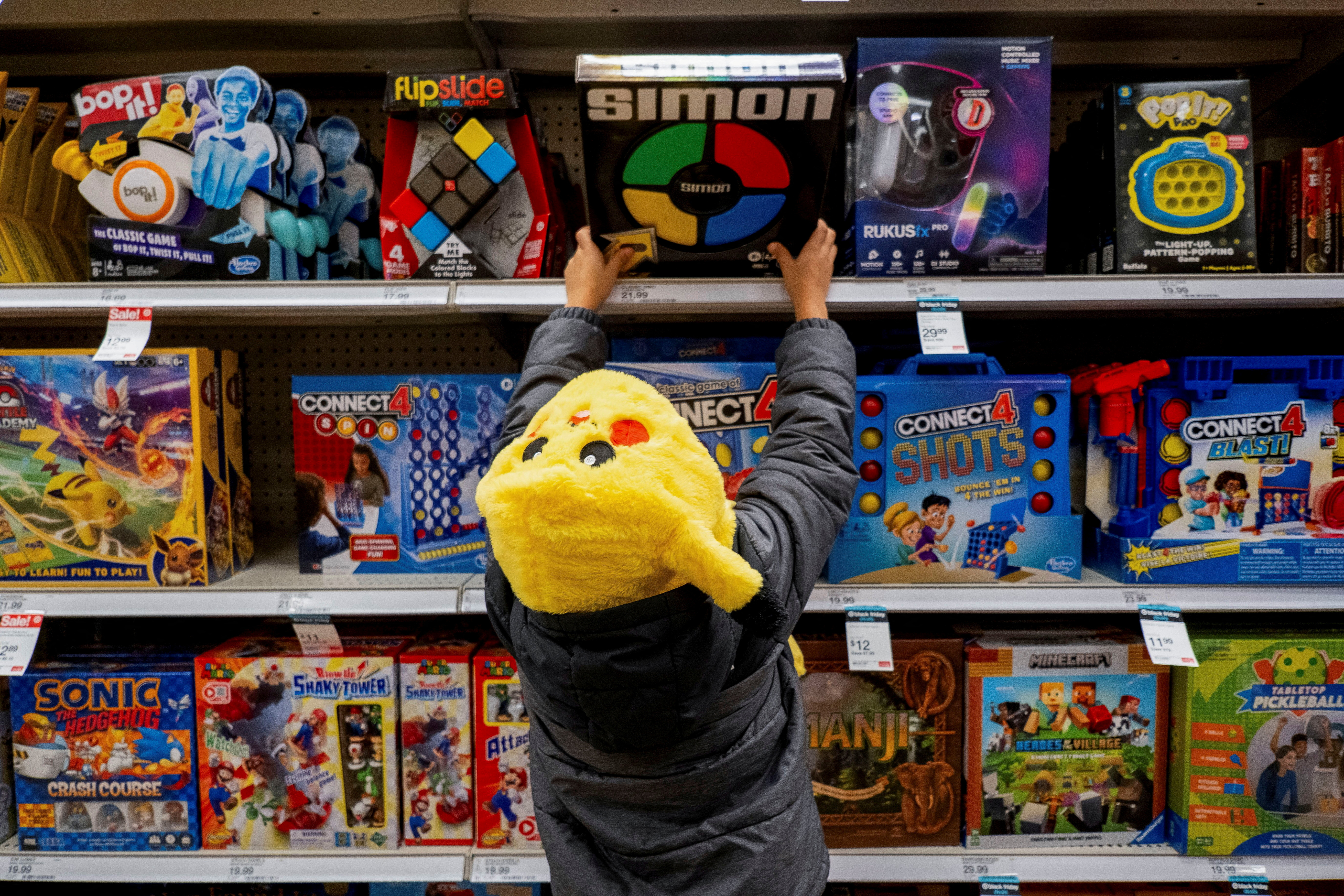 A child looks at toys in a Target store ahead of the Thanksgiving holiday and traditional Black Friday sales in Chicago, Illinois, U.S. November 21, 2023. 
