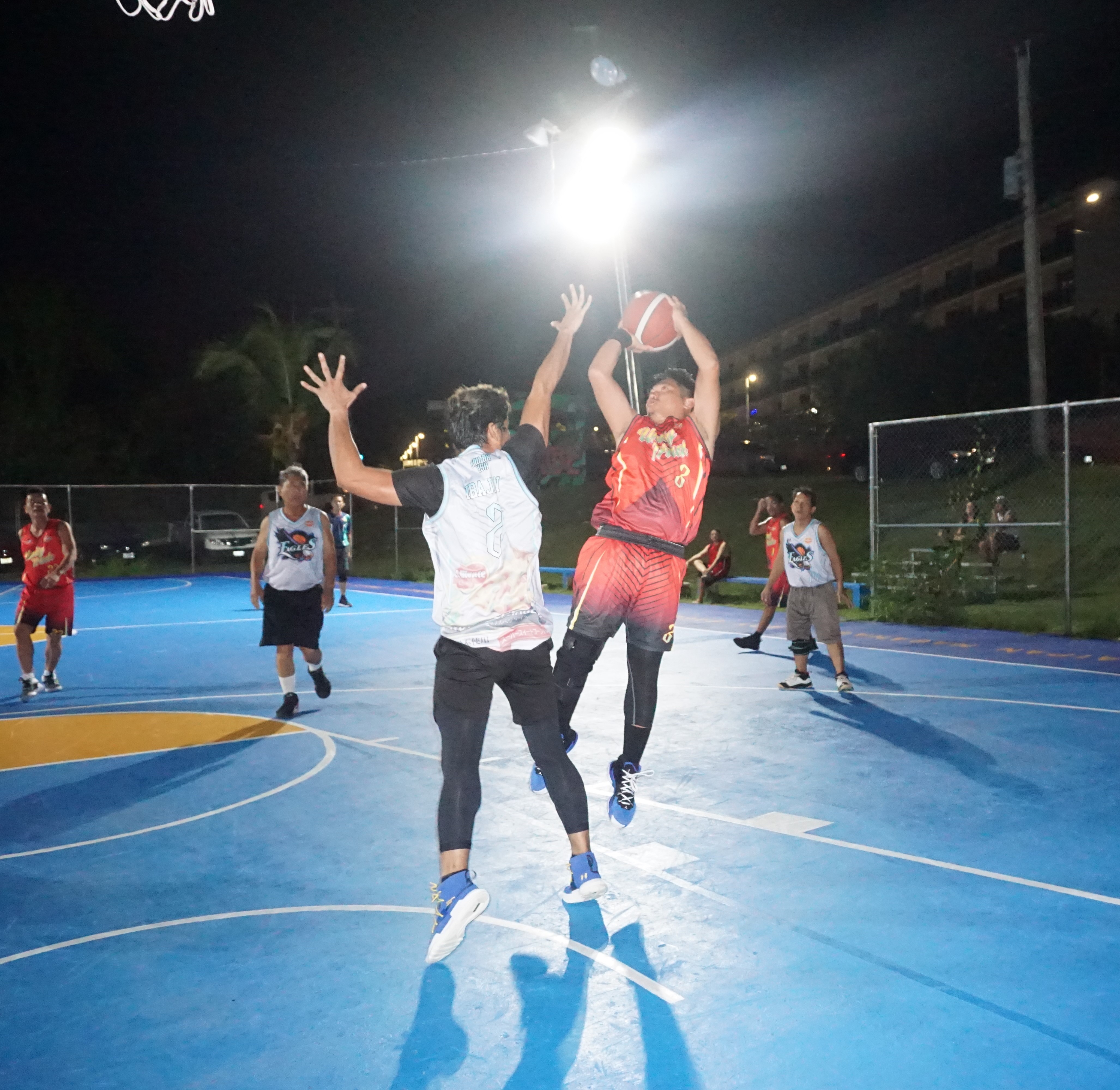 Unity Trade's Dan Chan takes the fadeaway shot against a defender during a game of the 2023 Pacific Saipan Promo Invitational Basketball League Thursday at the Gualo Rai basketball court.