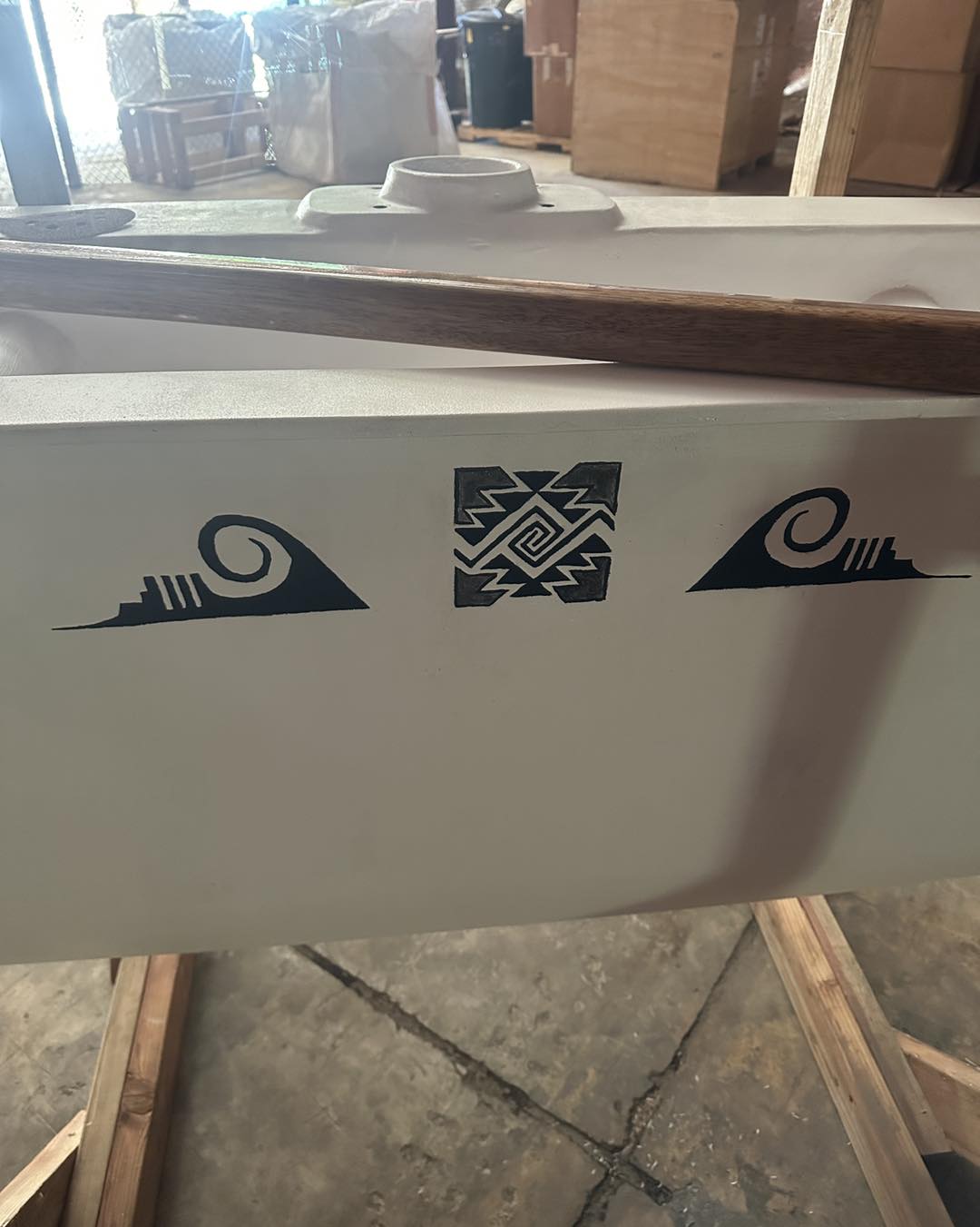 After consulting with his Native American family members in Arizona, Jeremiah Benavente included designs to his canoe that reference water.