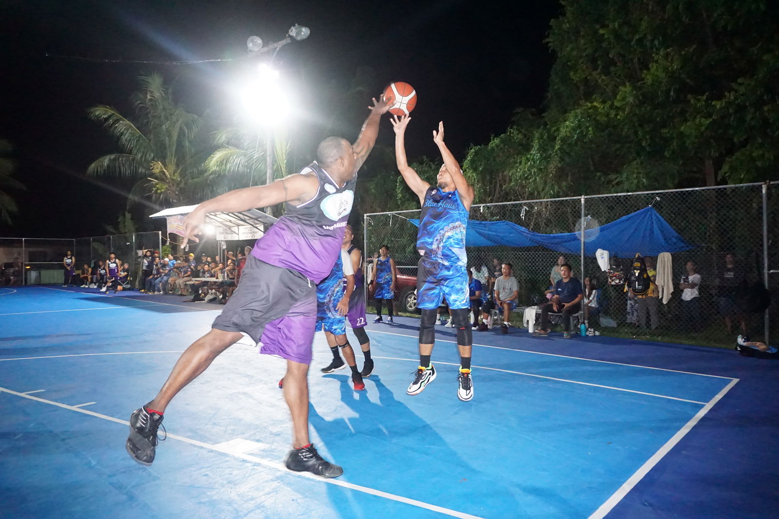 Blue Haus' Melvin Capalad takes the midrange shot over a defender.
