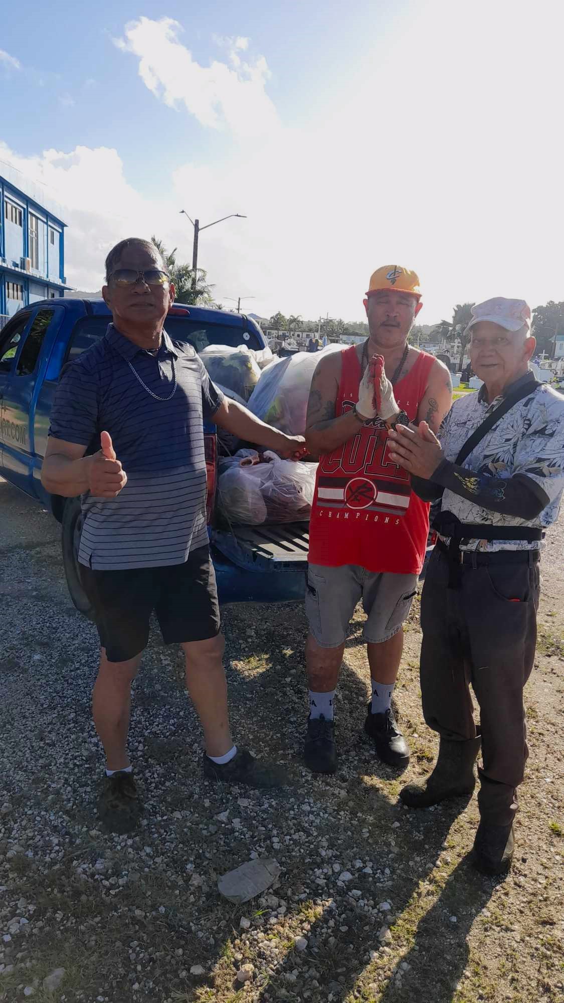 Community volunteers Max Aguon Felipe Fejeran and Alex Fejeran collected trash at the Chalan Kanoa cemetery on Saturday.