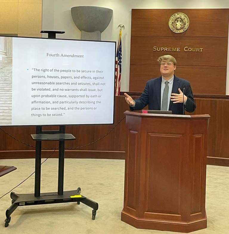 Patrick Quimby, law clerk to Chief Justice Alexandro C. Castro, explains the Fourth Amendment of the United States Constitution during a moot court workshop.