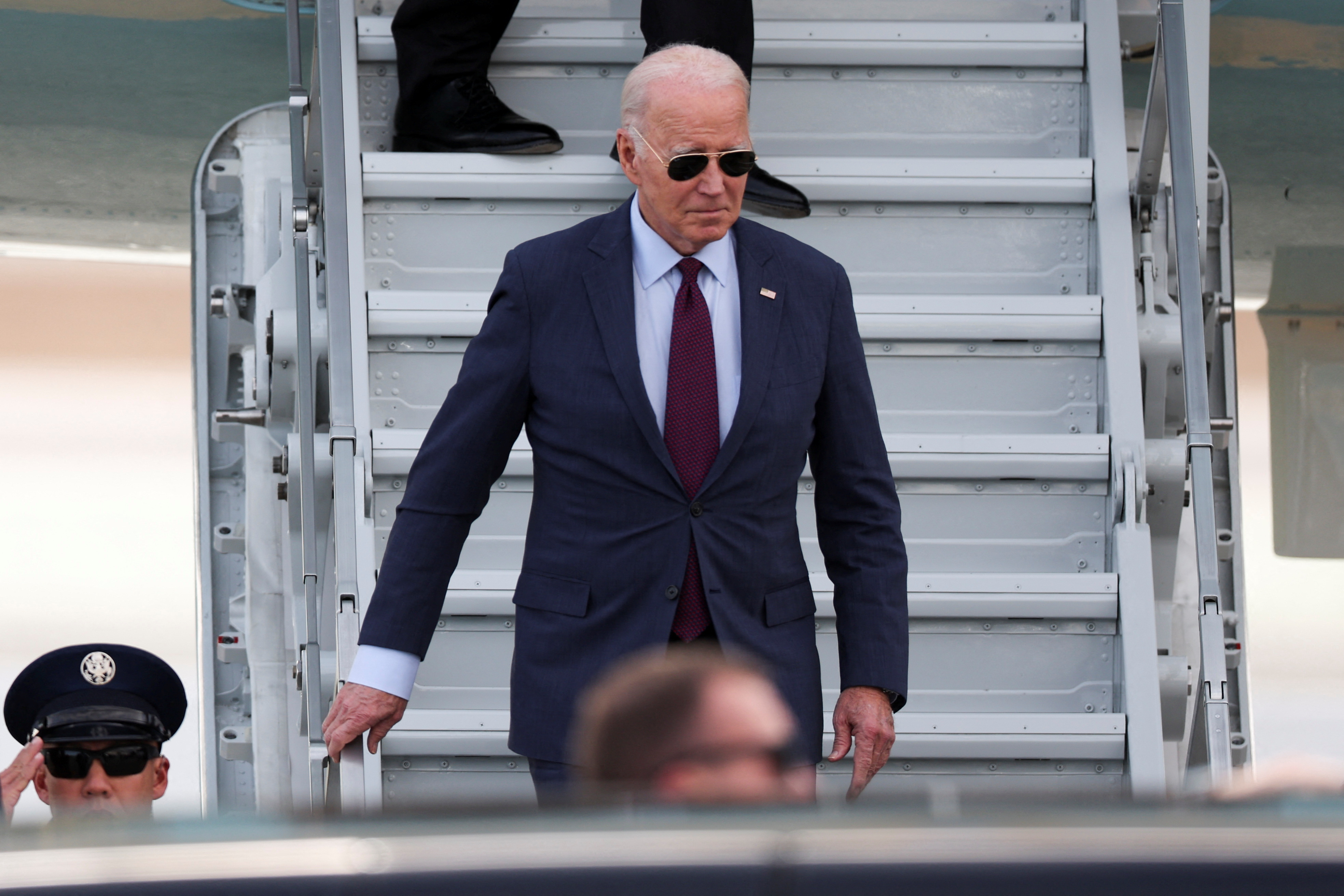 U.S. President Joe Biden disembarks from Air Force One at San Francisco International Airport, as he arrives to attend the APEC (Asia-Pacific Economic Cooperation) Summit in San Francisco, California, U.S., November 14, 2023. 