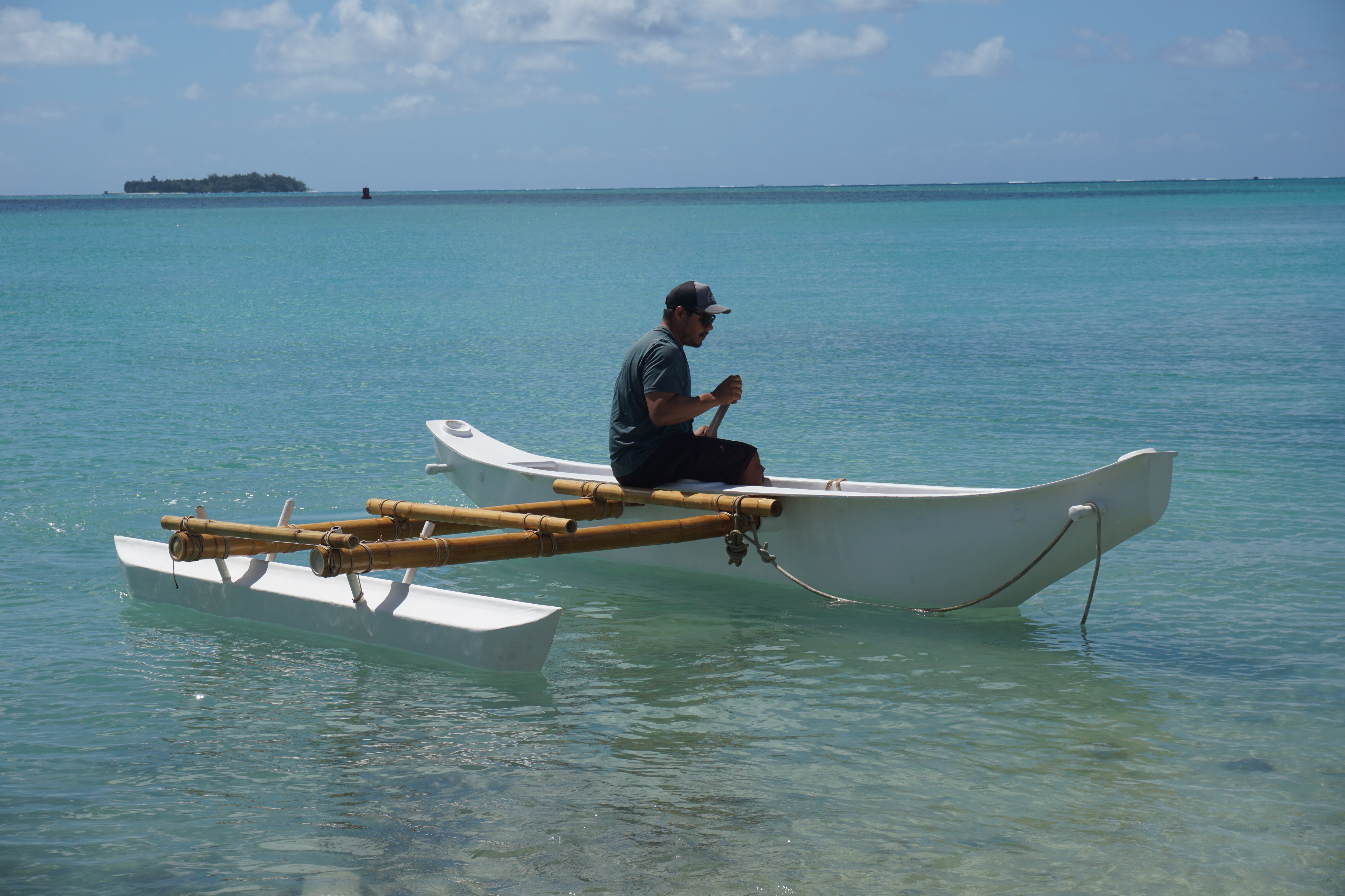 Jeremiah Benavente sits in the hull of Den Yo Povi, during a test of her buoyancy in April. Den Yo Povi officially launches from the Guma Sakman on Dec. 2.