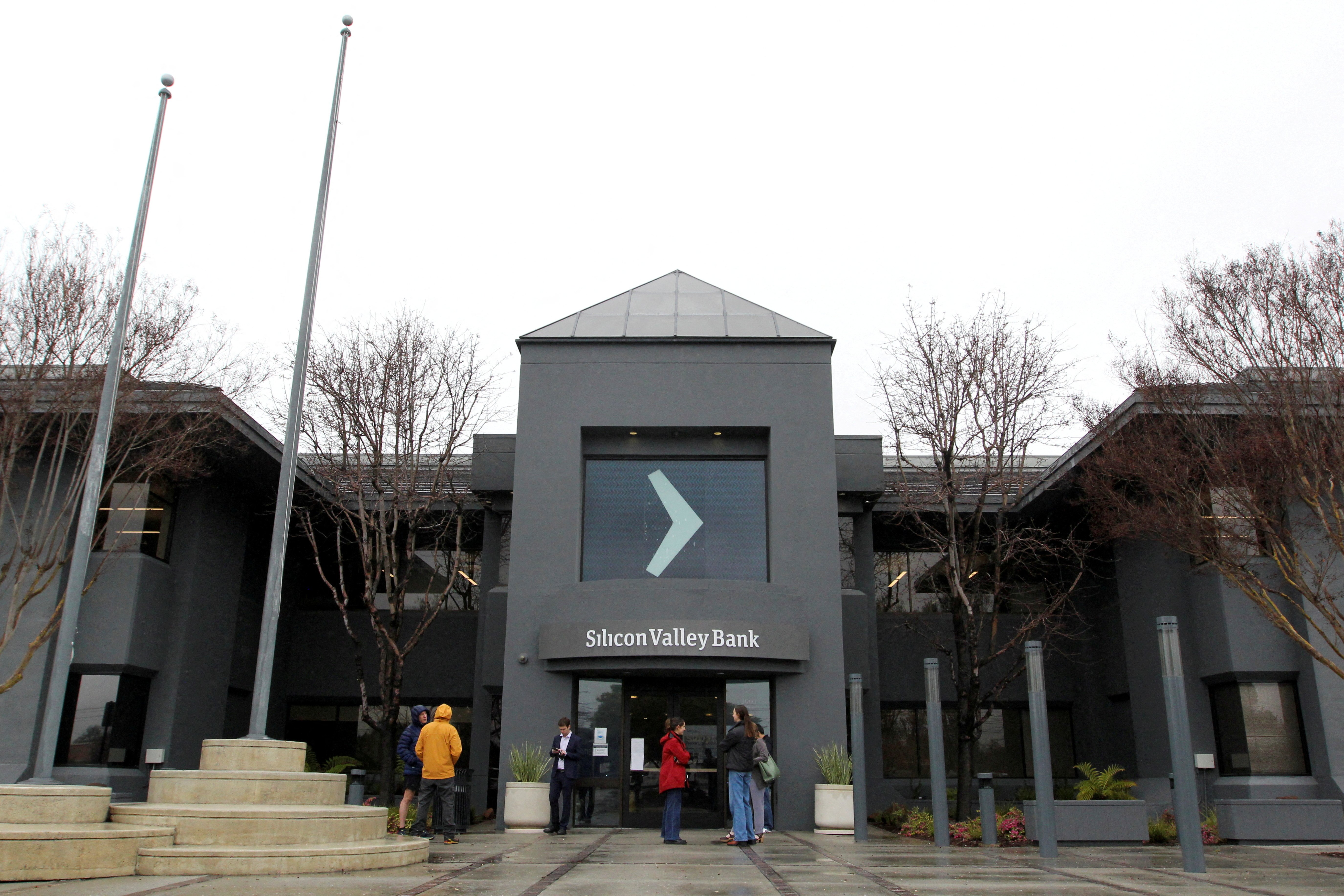 People gather outside of the Silicon Valley Bank (SVB) headquarters in Santa Clara, California, U.S. March 10, 2023. 