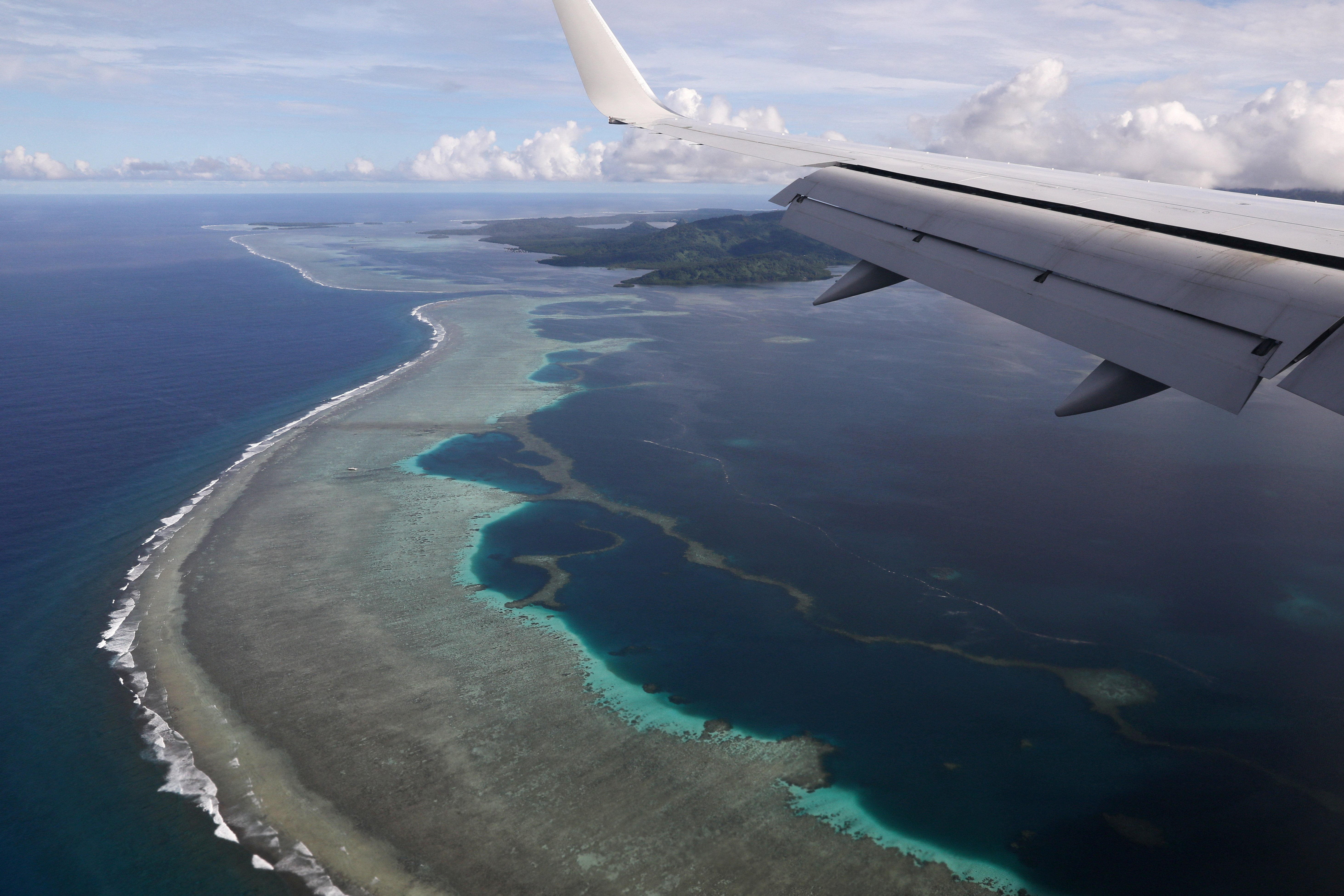 A plane carrying then-U.S. Secretary of State Mike Pompeo makes its landing approach on Pohnpei International Airport in Kolonia, Federated States of Micronesia August 5, 2019. 