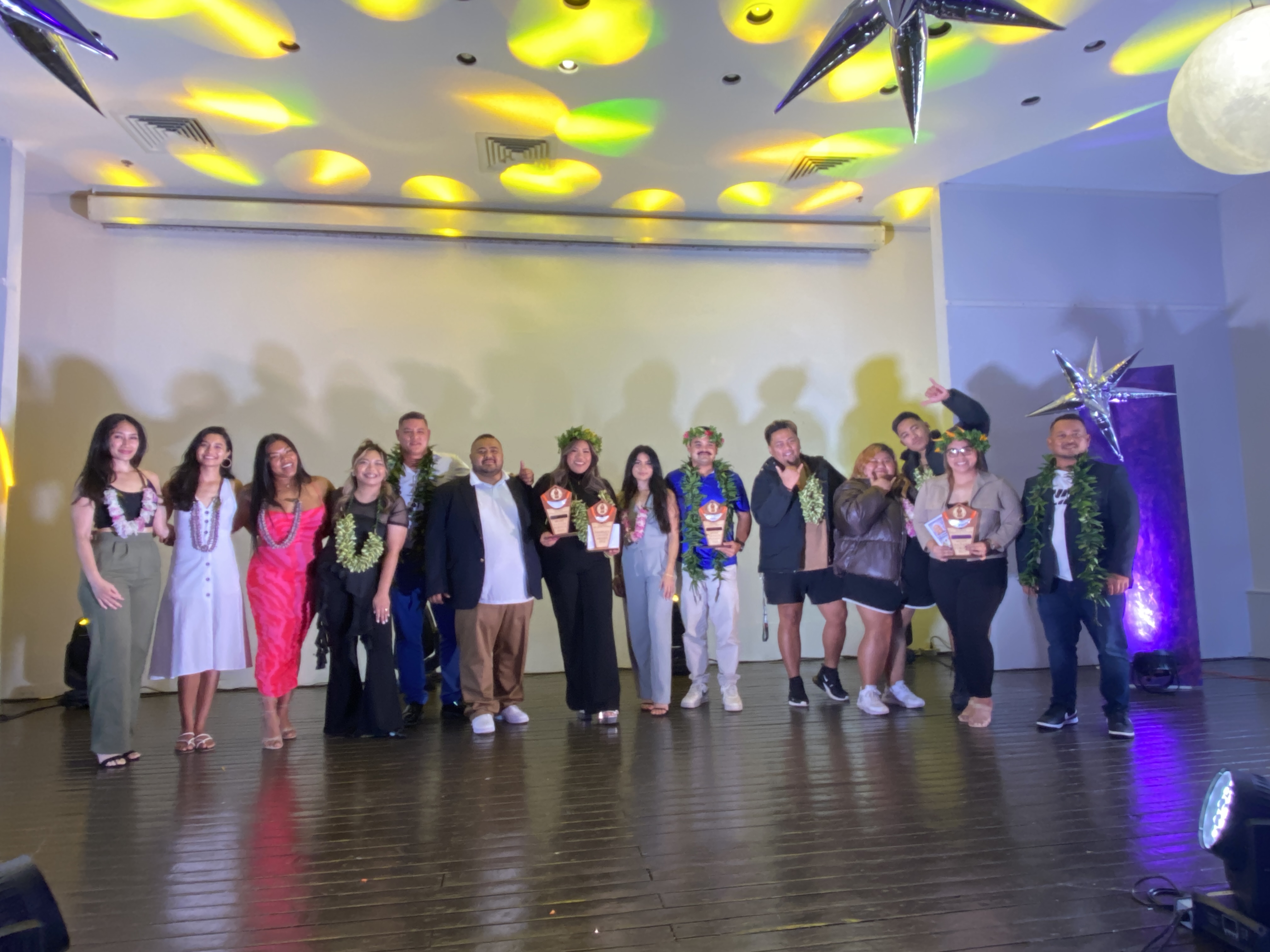 The 12 nominees for Tyler's Gelatte Stone's Most Badass People 2023 award pose for a group photo.