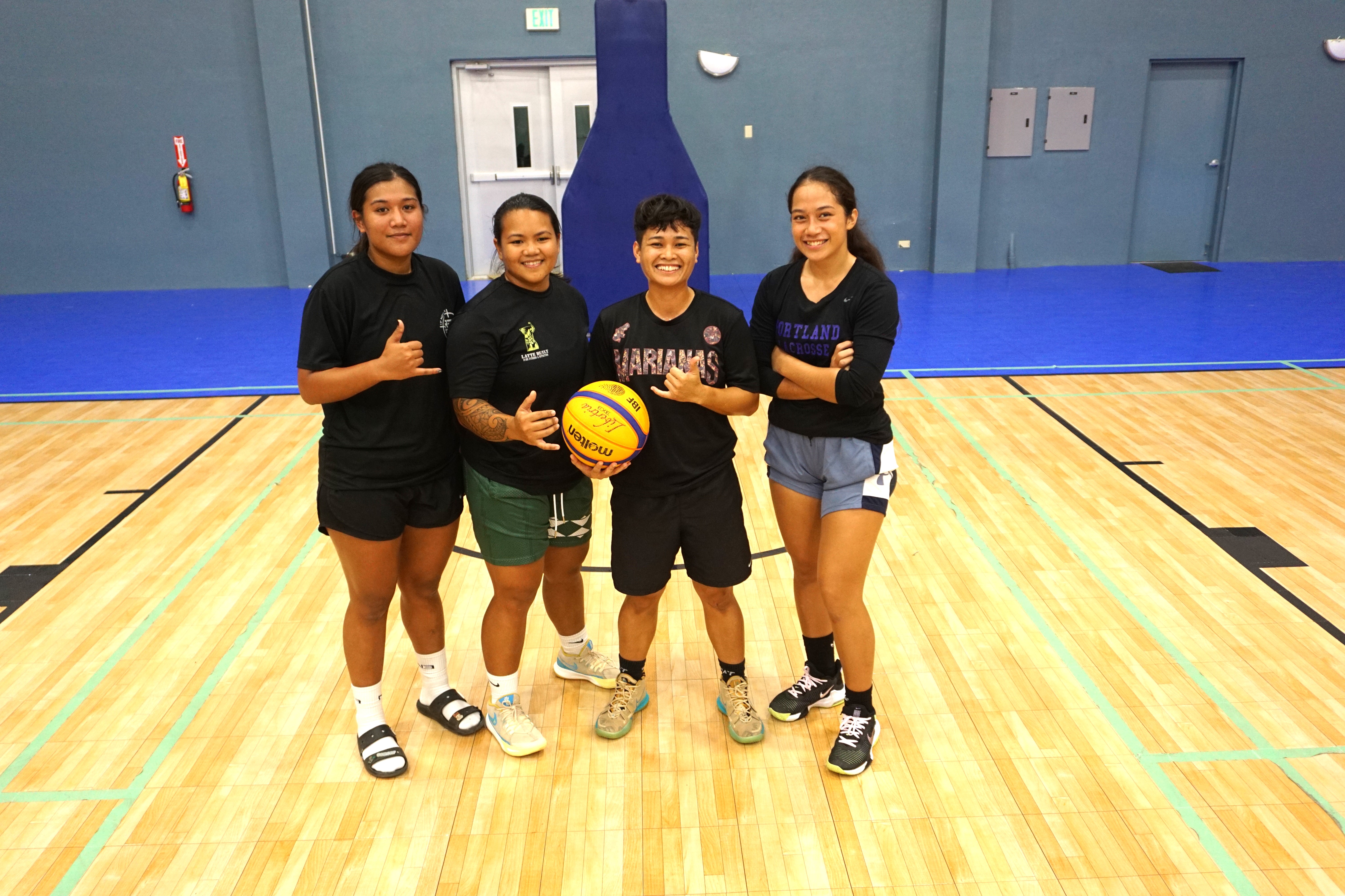 The Alley-Oopsie Daisies pose for a photo after winning the second women's division tournament of the Marianas Arsenal 3x3 Series on Saturday at the Ada gym. 