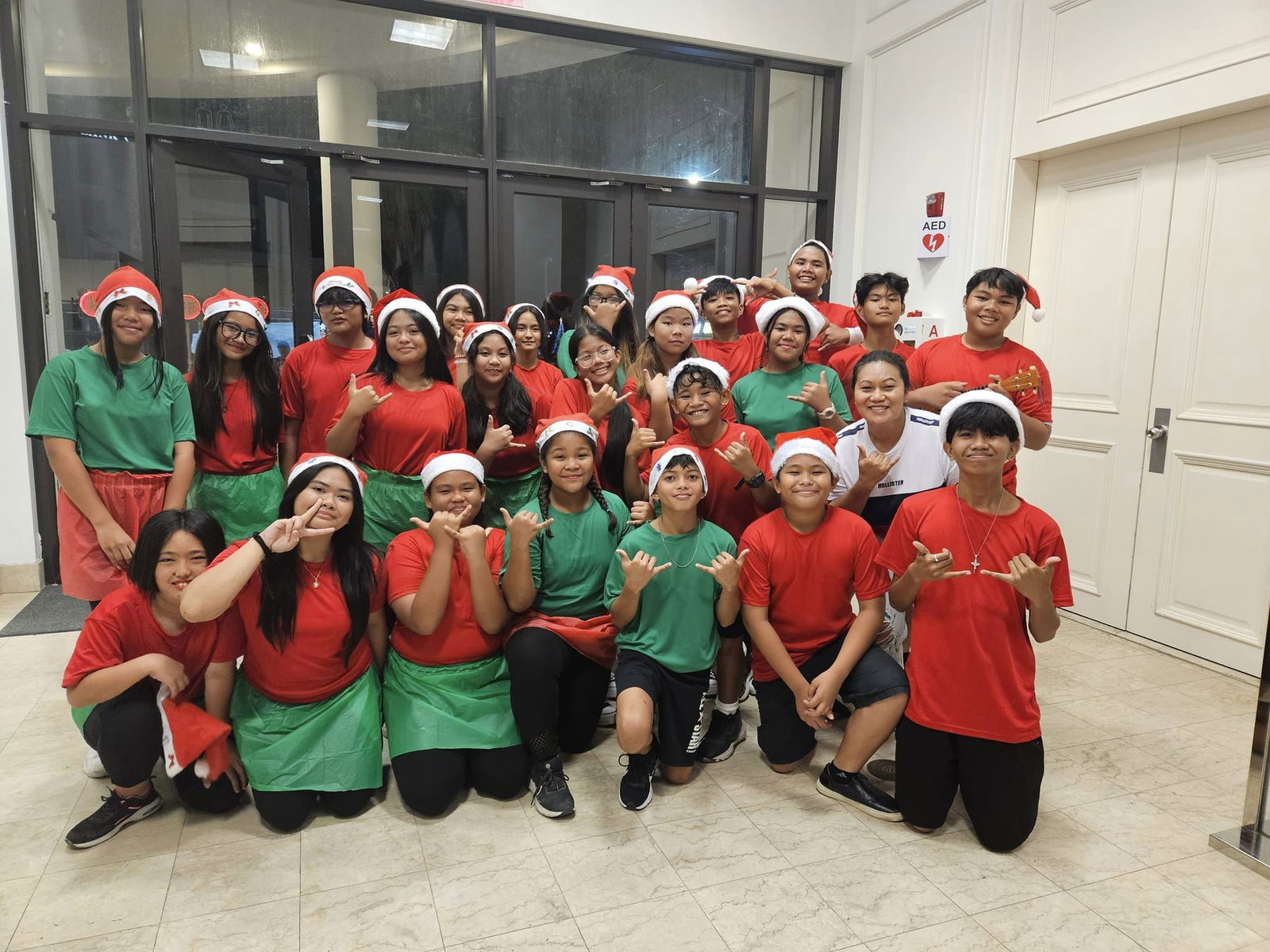 The HMS Glee Club, led by Glee Club director Karen Manuel.