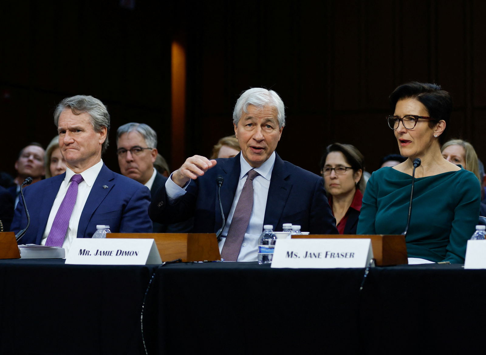 JPMorgan Chase Chairman and CEO Jamie Dimon speaks next to Bank of America Chairman and CEO Brian Thomas Moynihan and Citigroup CEO Jane Fraser during the U.S. Senate Banking, Housing and Urban Affairs Committee oversight hearing on Wall Street firms, on Capitol Hill in Washington, U.S., December 6, 2023. 