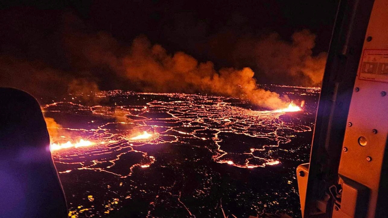 A volcano spews lava and smoke as it erupts near Grindavik, Iceland, Dec. 19, 2023.