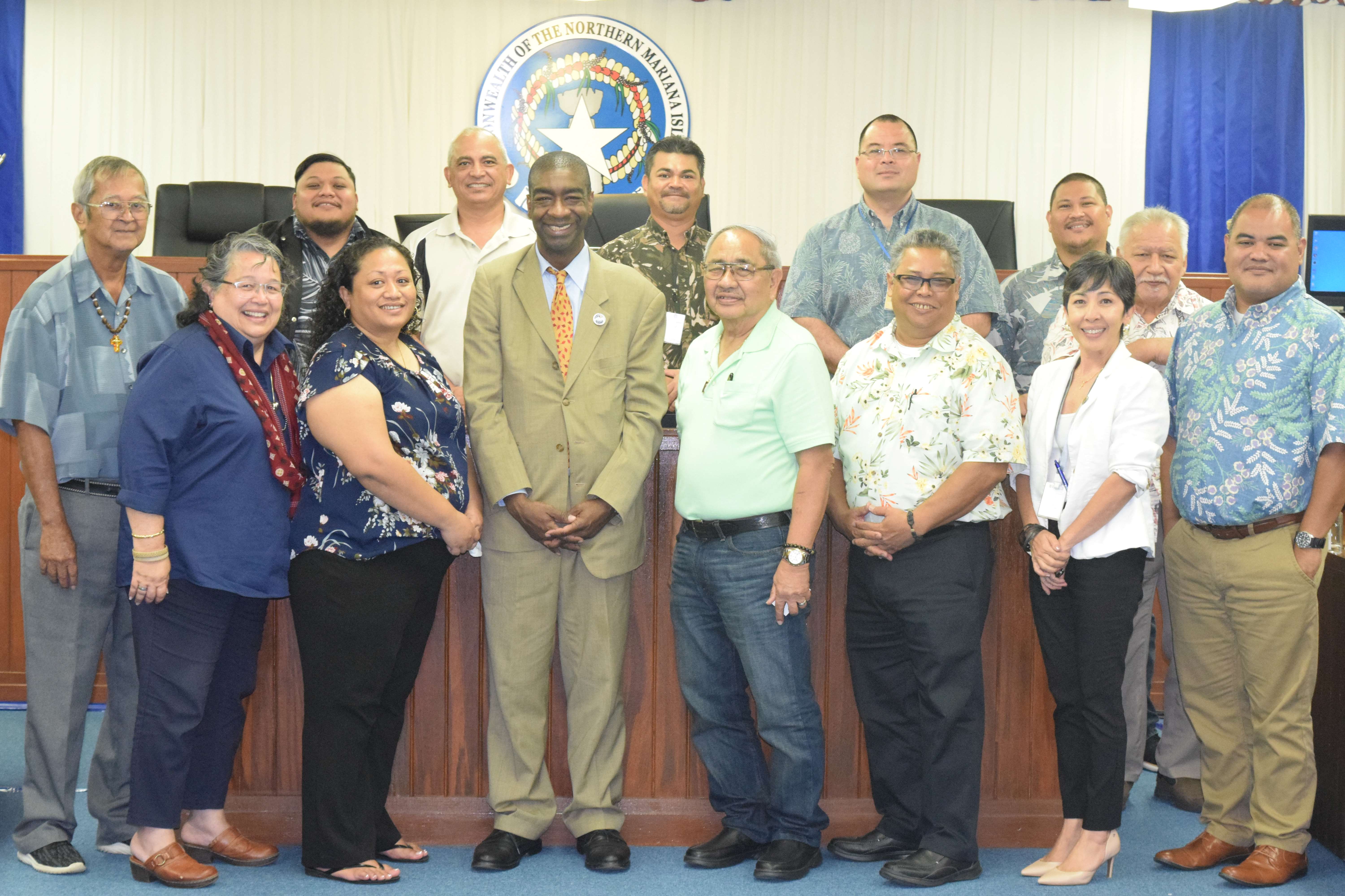 U.S. Election Assistance Commissioner Thomas Hicks, fourth left, front row, poses for a photo with members of the local House of Representatives as well as officials of the Commonwealth Election Commission and the Guam Election Commission in the CNMI House chamber on Tuesday.