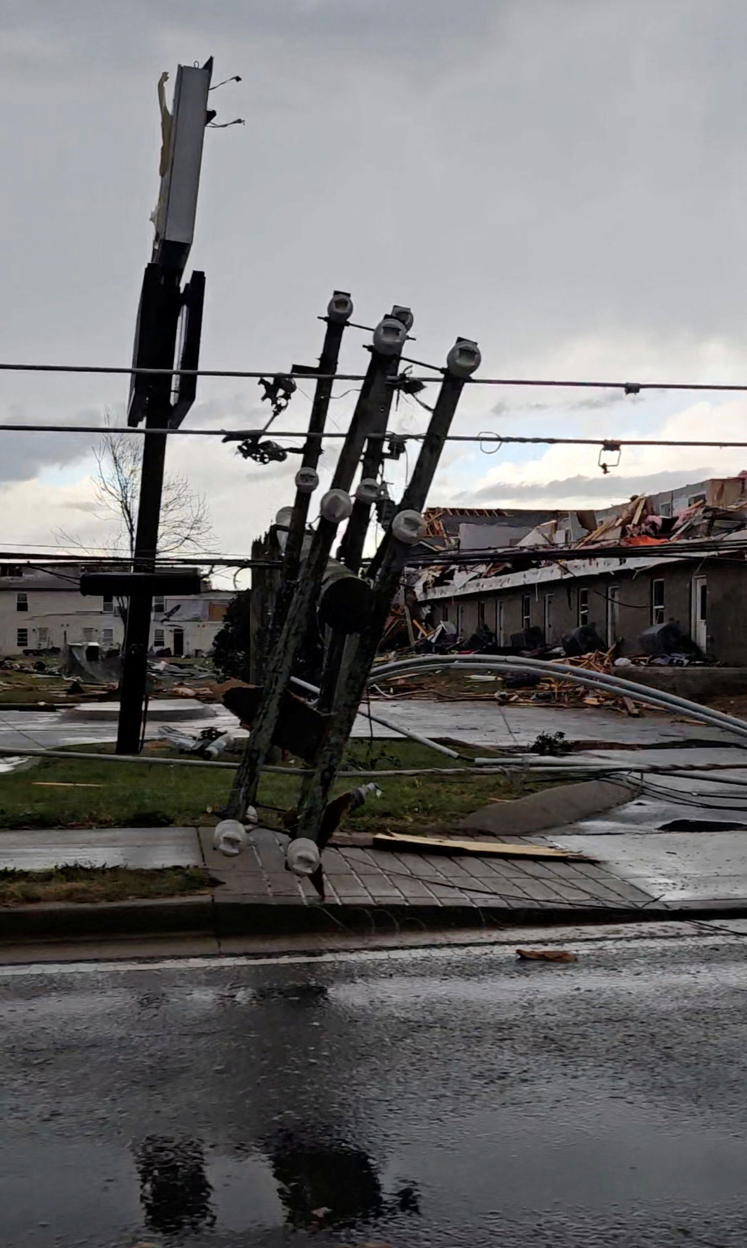 A downed light pole and damaged houses following a possible tornado at Clarksville,Tennessee, U.S., December 9, 2023, in this screen grab taken from a social media video.