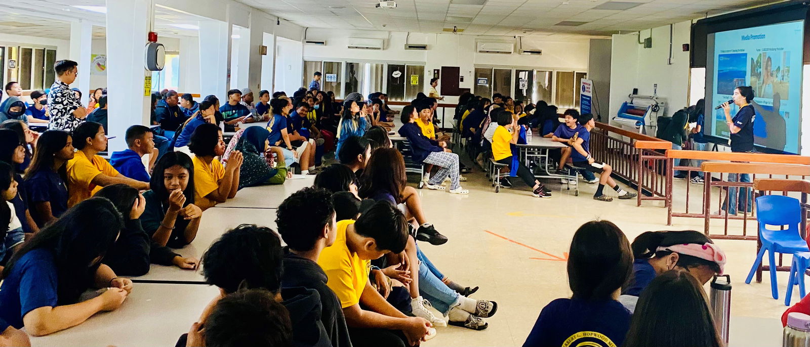 Marianas Tourism Education Council Board Member Catherine Perry talks about tourism with students of Admiral Herbert G. Hopwood Middle School during the educational outreach presentation of MTEC and the Marianas Visitors Authority on Dec. 5, 2023, at the school.