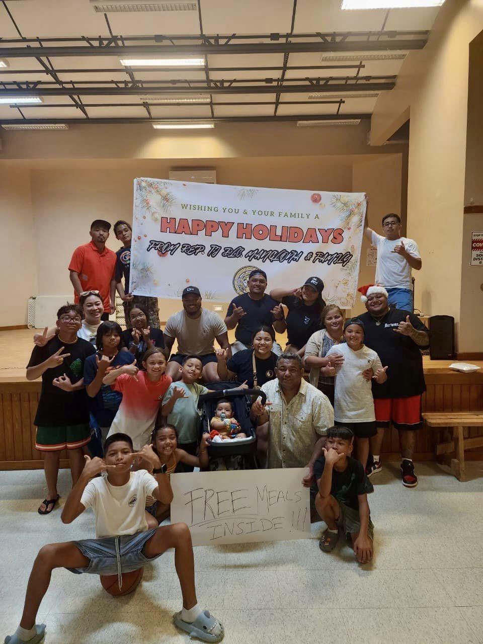 Staff and supporters of Rep. TJ Manglona pose for a photo at the Kagman Community Center on Christmas Eve.