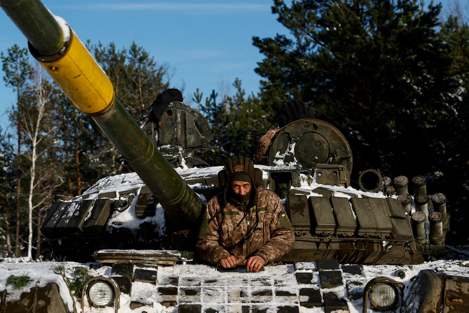 A Ukrainian serviceman sits in a tank during anti-sabotage drills, amid Russia's attack on Ukraine, in Chernihiv region, Ukraine December 5, 2023. 