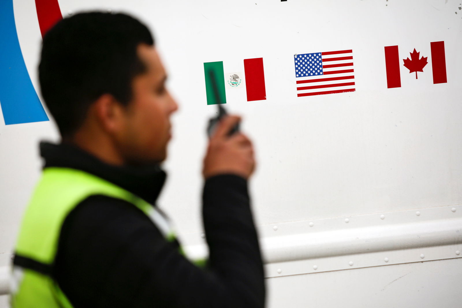 Flags of Mexico, United States and Canada are pictured at a security booth at Zaragoza-Ysleta border crossing bridge, in Ciudad Juarez, Mexico January 16, 2020. 