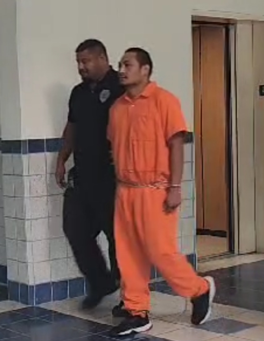 Alexander Borja, 32, is escorted by a Corrections officer at the courthouse on Wednesday.