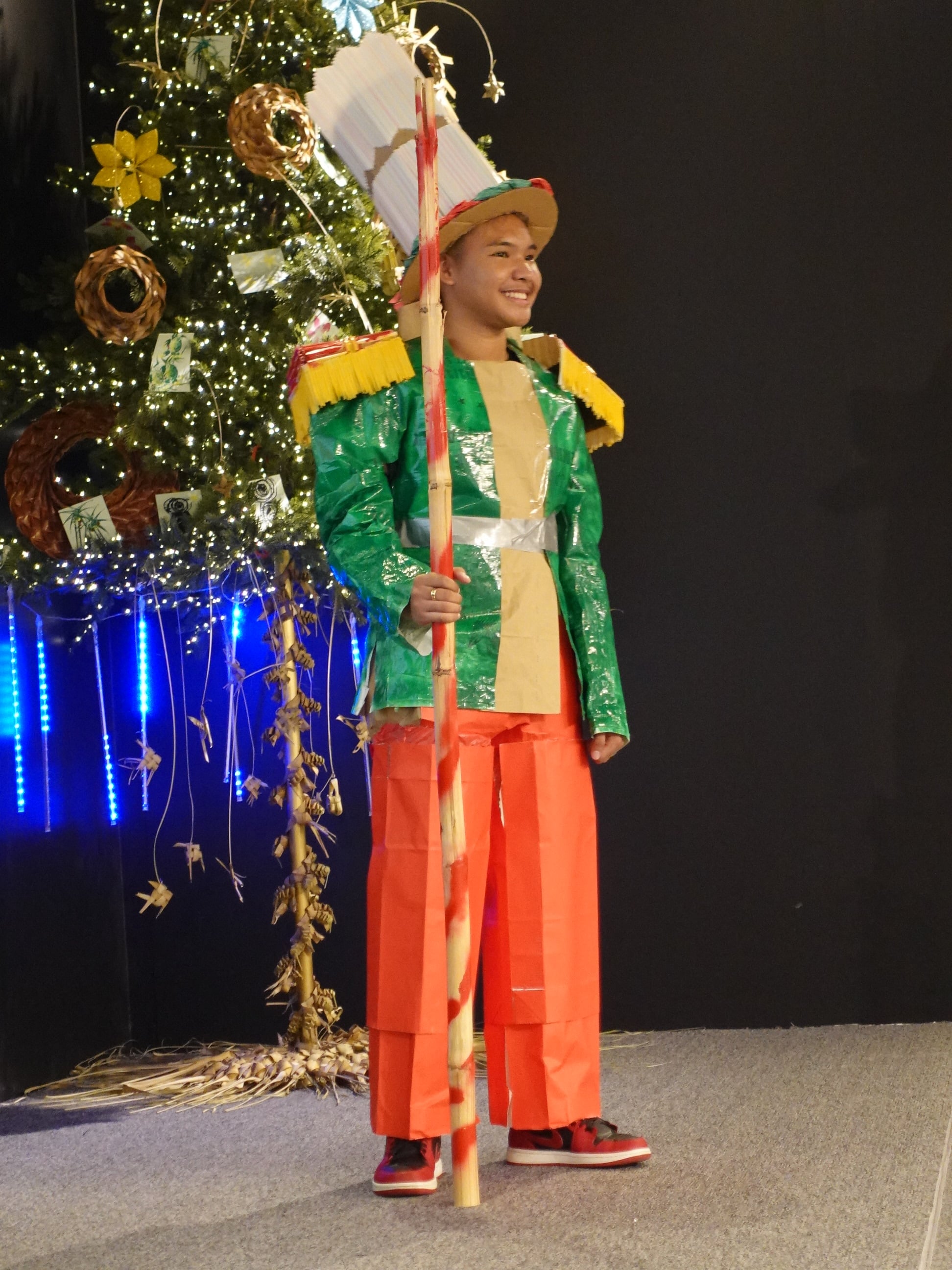 A student from Marianas High School shows off his costume made from recyclable material at the 19th Annual Christmas in the Marianas on Dec. 16, 2023, at T Galleria in Garapan, Saipan. 