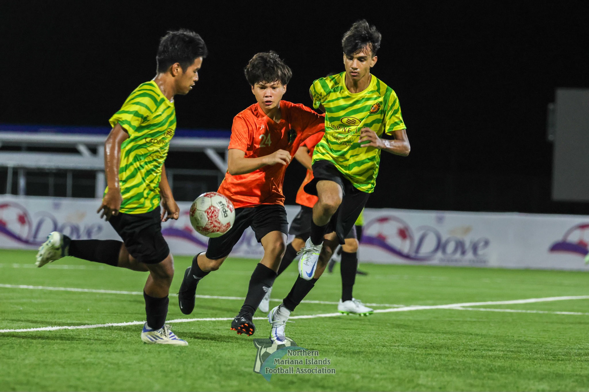Matansa’s Heman Addy and MD Arif Hossain control the possession as Kanoa's John Quidato closes in  during a U17 boys division  game of the TakeCare Youth Soccer League Fall 2023 at the NMI Soccer Training Center in Koblerville. 