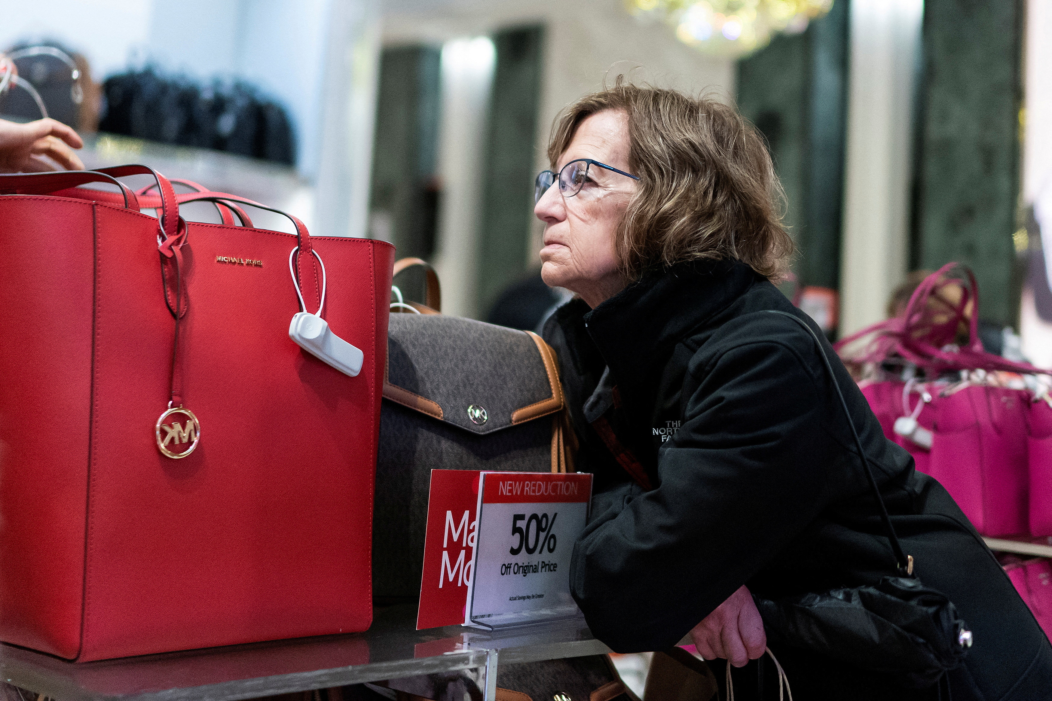 A woman looks for presents at the Macy's flagship store during the holiday season in New York City, U.S., December 10, 2023. 