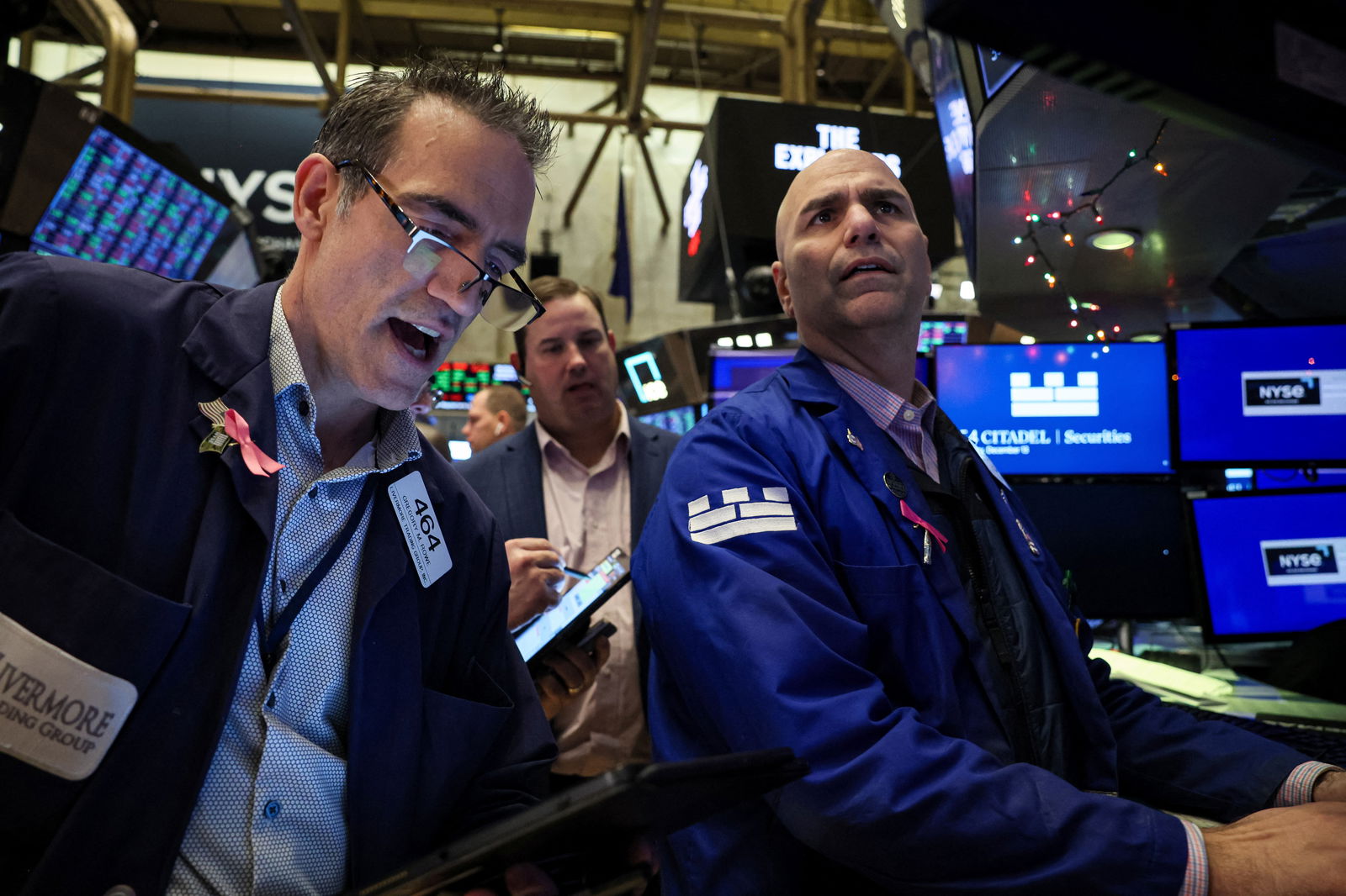 Traders work on the floor at the New York Stock Exchange (NYSE) in New York City, U.S., December 13, 2023. 