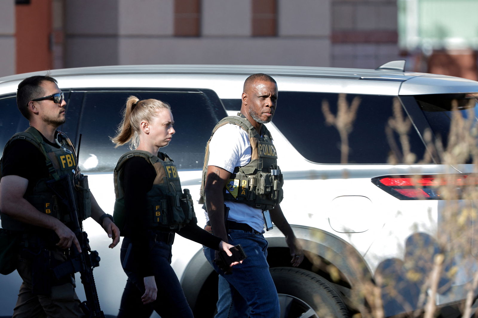 Law enforcement officers walk on UNLV campus after reports of an active shooter in Las Vegas, Nevada, U.S. December 6, 2023. 