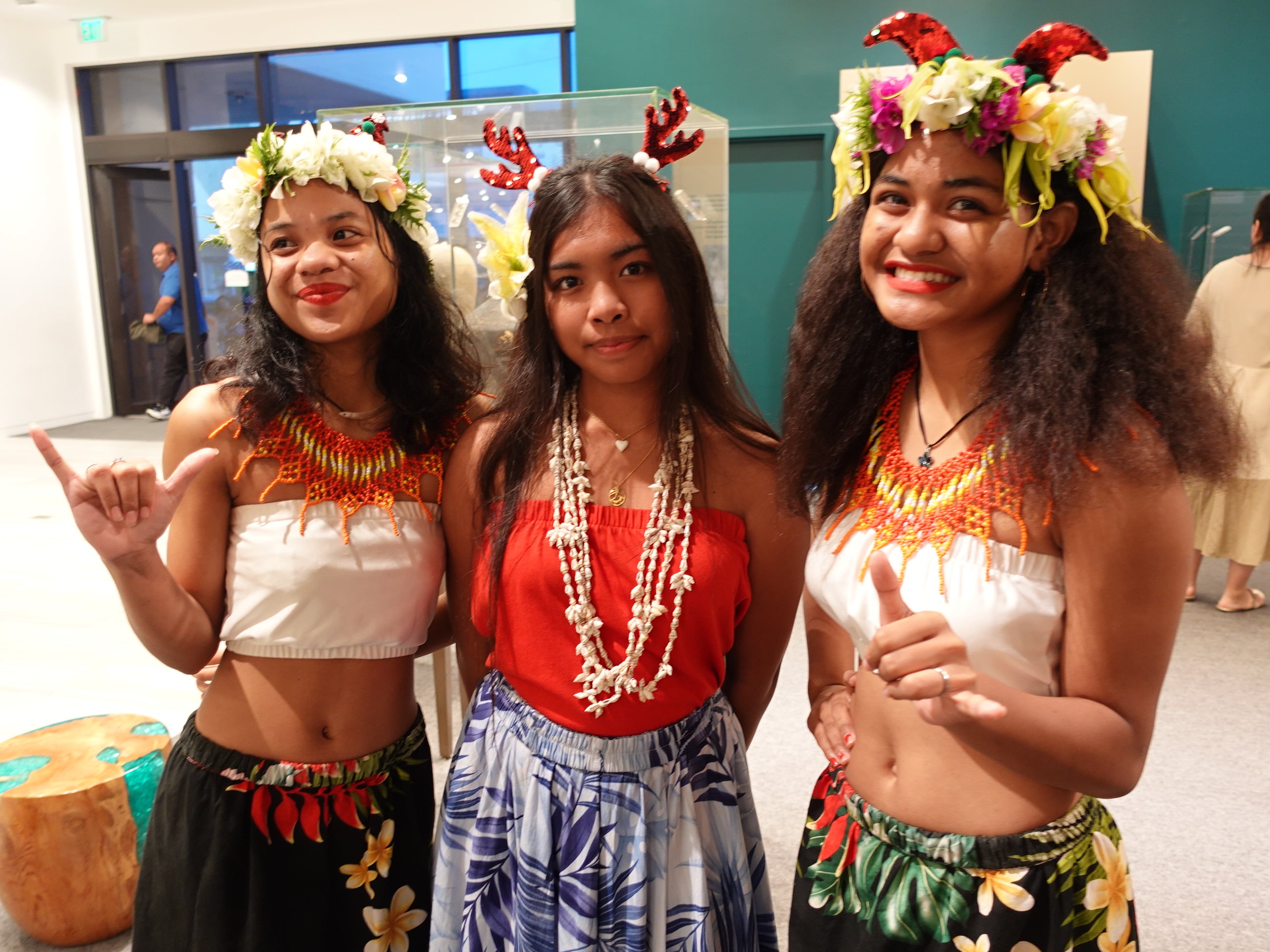 Josefina Norita, Jriannalynn Torres, and Telinamae Mality take a pause from dancing for a photo at the 19th Annual Christmas in the Marianas on Dec. 16, 2023, at T Galleria in Garapan, Saipan.