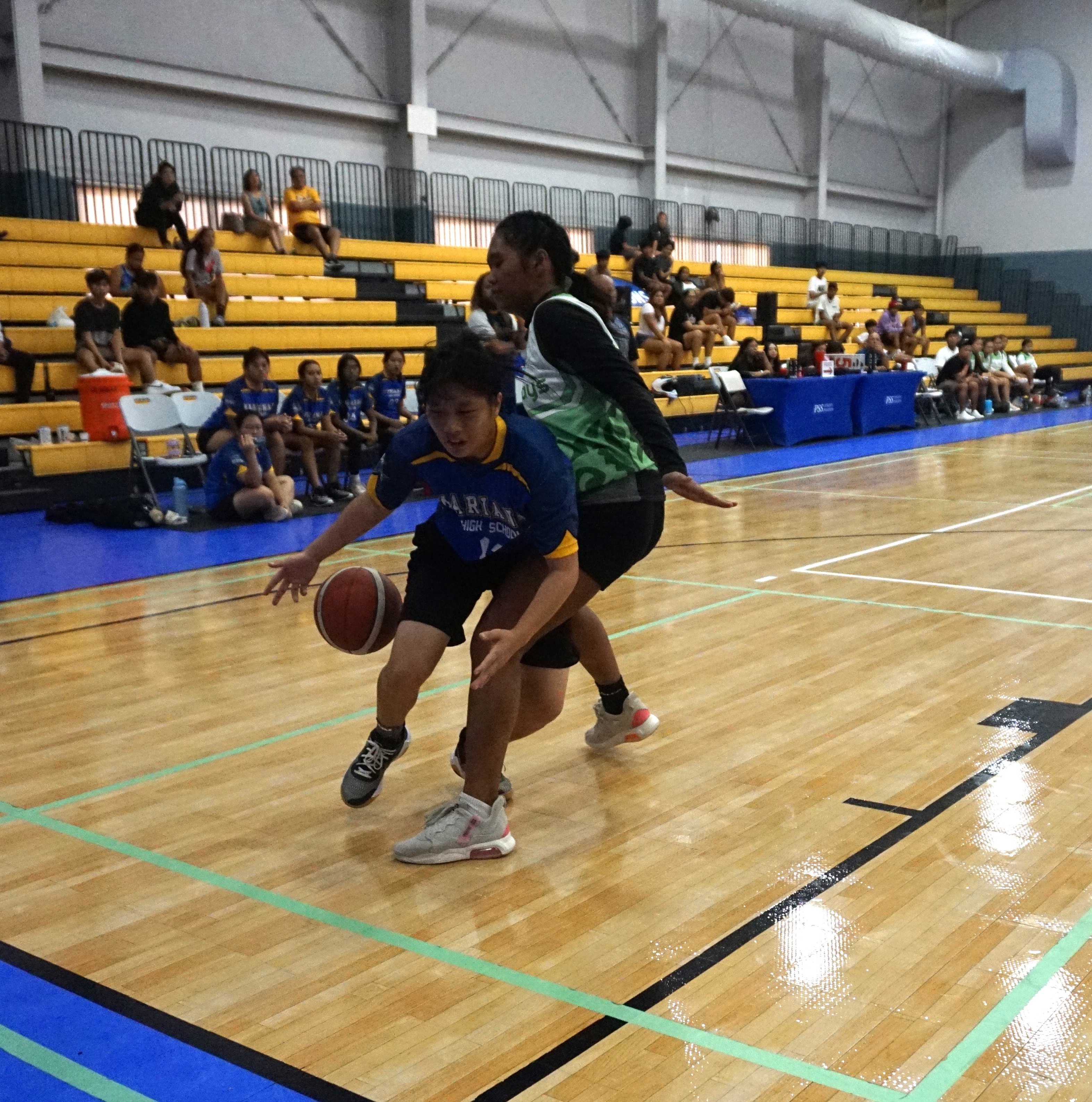 MHS' Jenny Lin gets fouled as she attempts to drive past a defender.
