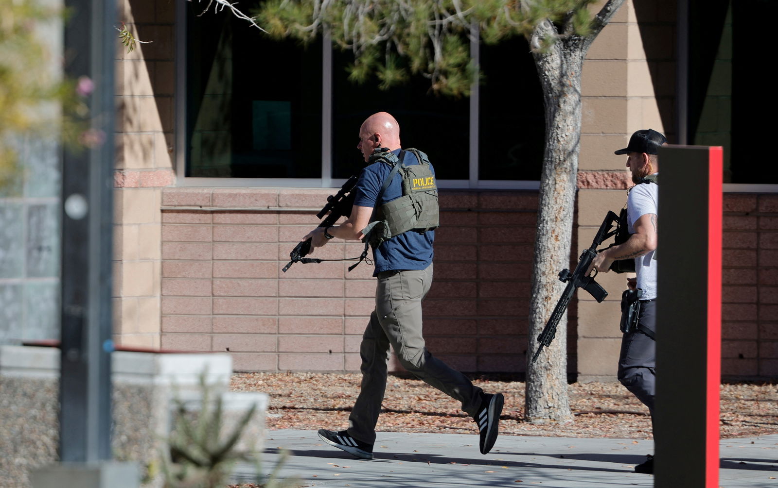 Law enforcement officers head into UNLV campus after reports of an active shooter in Las Vegas, Nevada, U.S. December 6, 2023. 