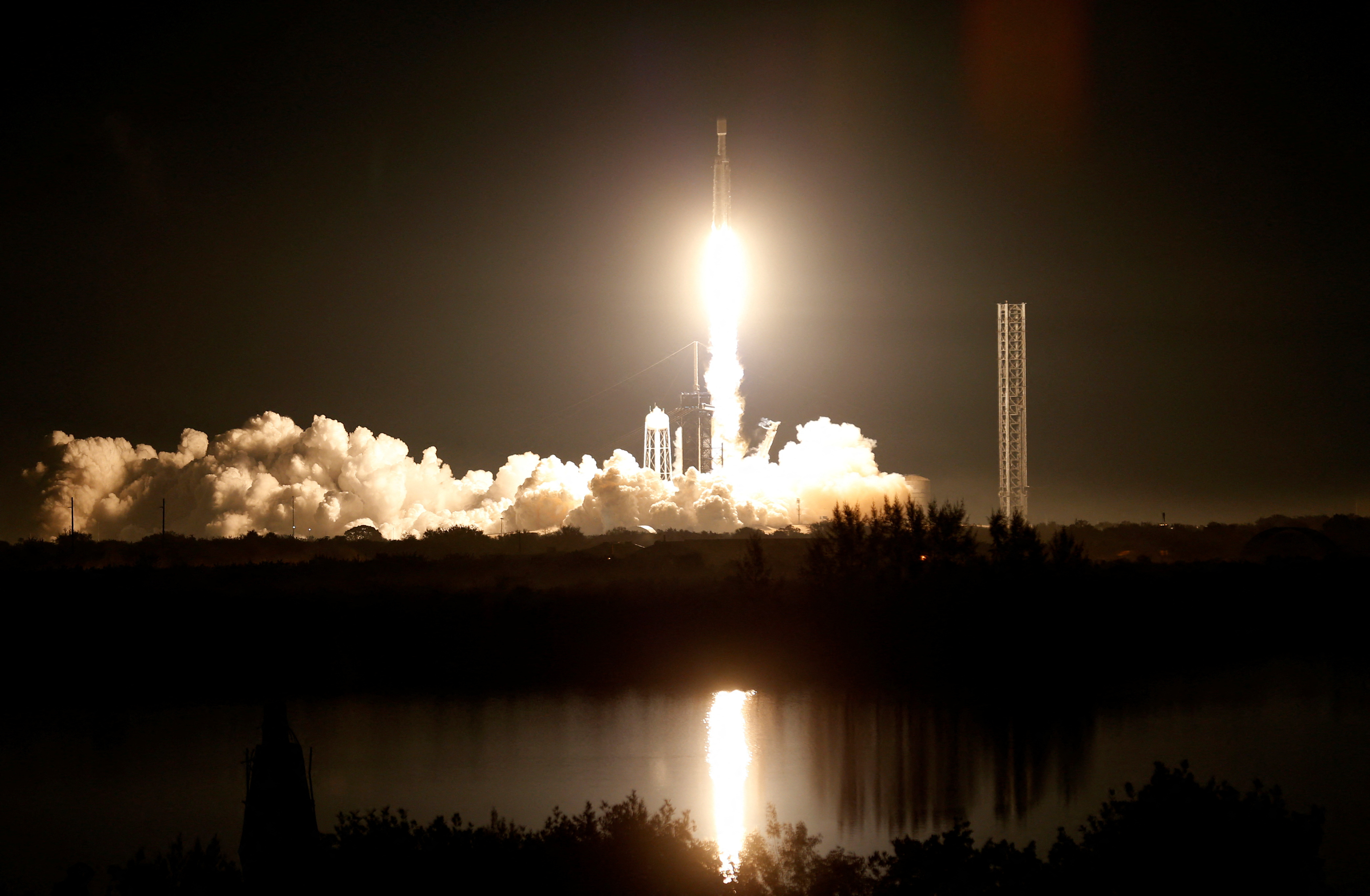 The U.S. military's secretive X-37B robot spaceplane lifts off on its seventh mission to orbit, the vehicle's first launch atop a SpaceX Falcon Heavy rocket capable of lofting it far higher than ever before from the Kennedy Space Center in Cape Canaveral, Florida, U.S., December 28, 2023.