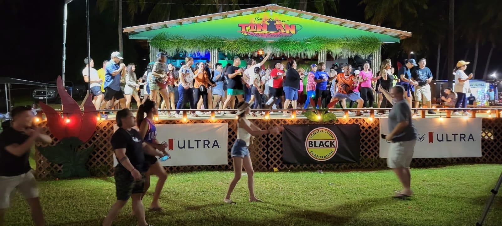 The crowd participates in a group dance at the 19th Annual Tinian Hot Pepper Festival, held on Feb. 18-19, 2023, in San Jose, Tinian.  The 20th Annual Tinian Hot Pepper Festival organized by the Marianas Visitors Authority will be held on Feb. 16-17, 2024.