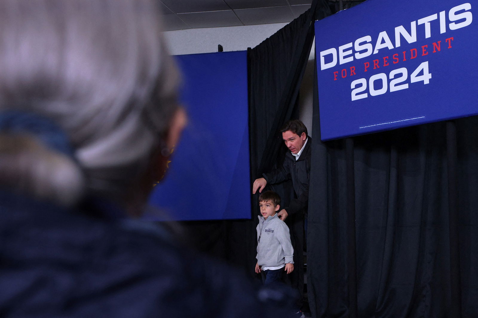 Republican presidential candidate Florida Governor Ron DeSantis and his son Mason take the stage at a Never Back Down campaign stop in Concord, New Hampshire, U.S., December 15, 2023. 