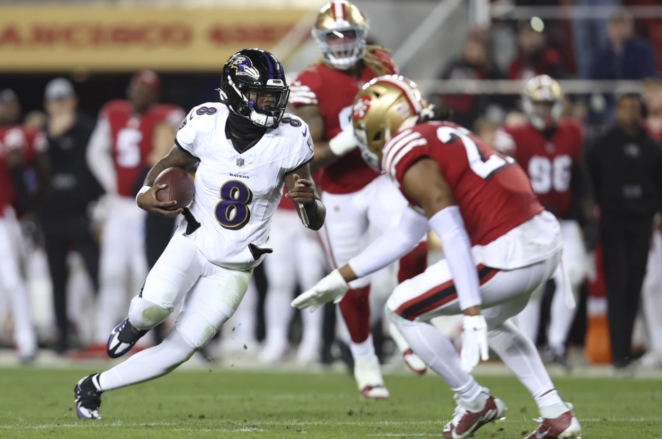Baltimore Ravens quarterback Lamar Jackson (8) runs against the San Francisco 49ers during the first half of an NFL game in Santa Clara, Calif., Monday, Dec. 25, 2023.