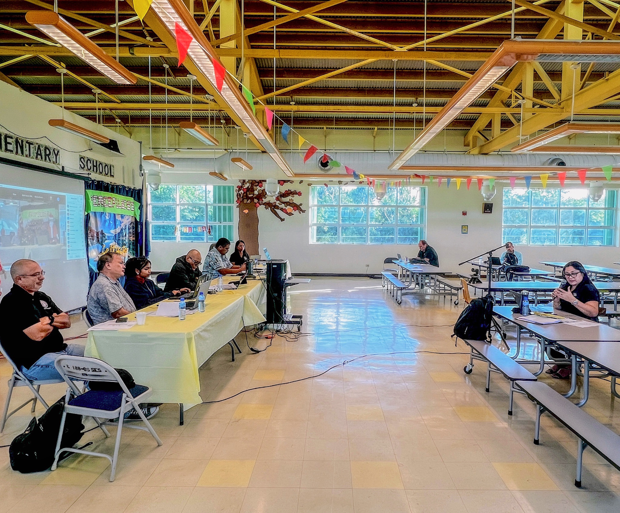The policymaking and governing body of the Public School System, the Board of Education held its regular meeting Monday in the cafeteria of Sinapalo Elementary School on Rota. Photo shows Interim Commissioner of Education Donna M. Flores, right, providing updates to BOE Chairperson Antonio L. Borja, Vice Chairperson Herman Atalig, Secretary/Treasurer Gregory Pat Borja, Member Andrew L. Orsini, Member Maisie B. Tenorio, Teacher Representative Dr. Dora B. Miura, and Student Representative Jane Nicole Mozunder. The BOE holds meetings on the CNMI’s three major islands. 