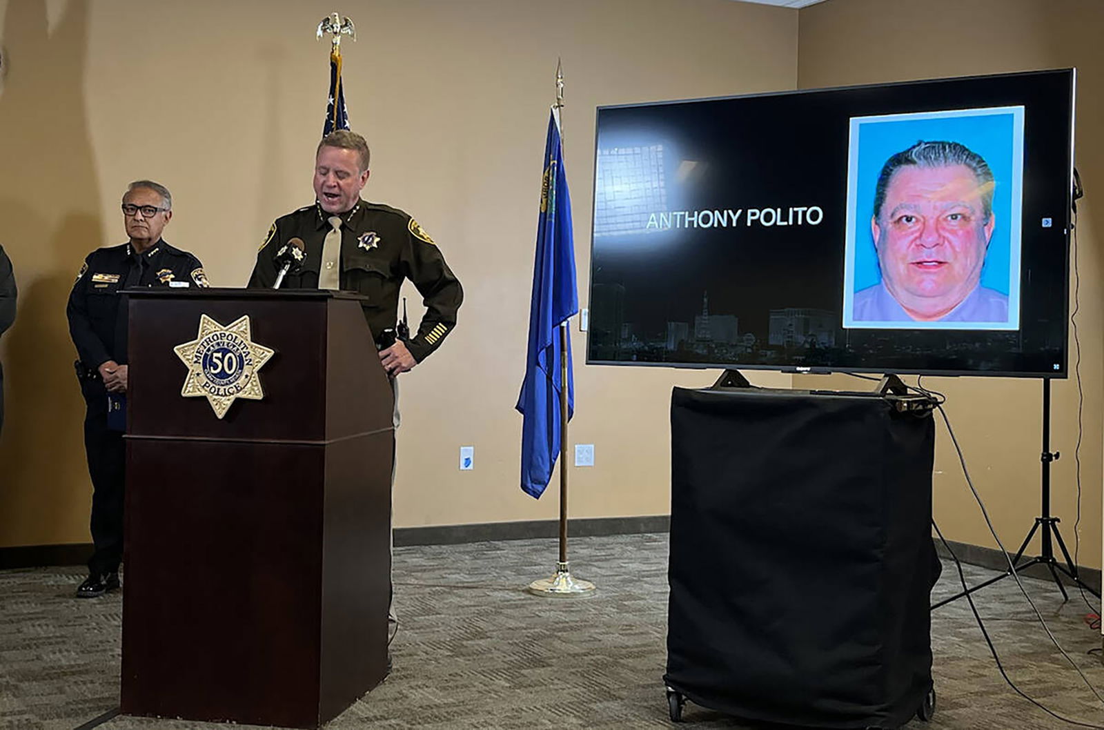 Clark County Sheriff Kevin McMahill talks to the media on Dec. 7, 2023, about the shooting at UNLV on Dec. 6, 2023. The displayed mug is that of Anthony Polito, 67, the gunman killed by UNLV police after he had engaged in a gun battle at Beam Hall, killing three and injuring another. (James Schaeffer/Las Vegas Review-Journal/TNS)