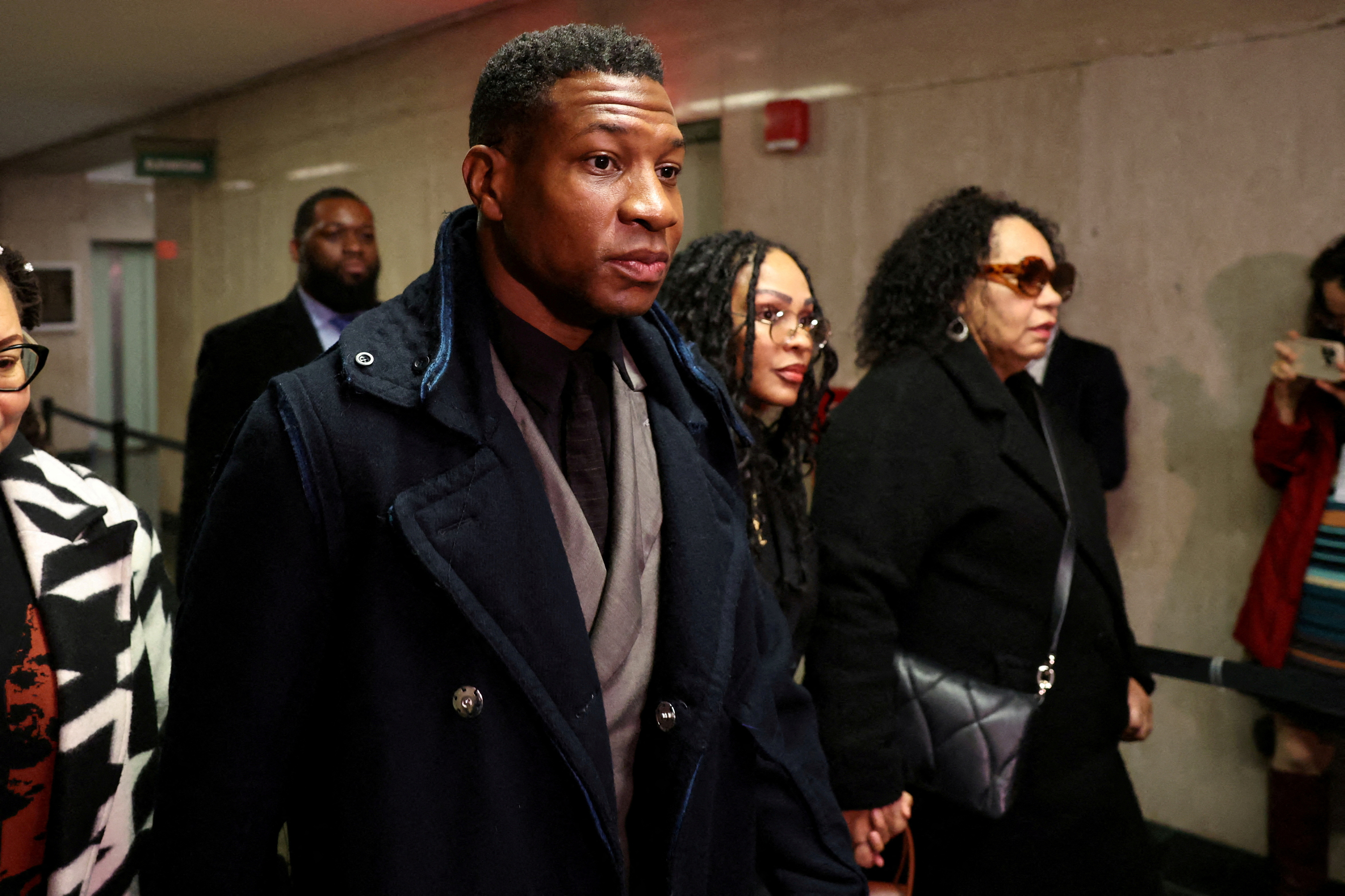 Actor Jonathan Majors arrives with Meagan Good for the jury selection in his assault and harassment case at Manhattan Criminal Court in New York City, U.S., December 18, 2023. 