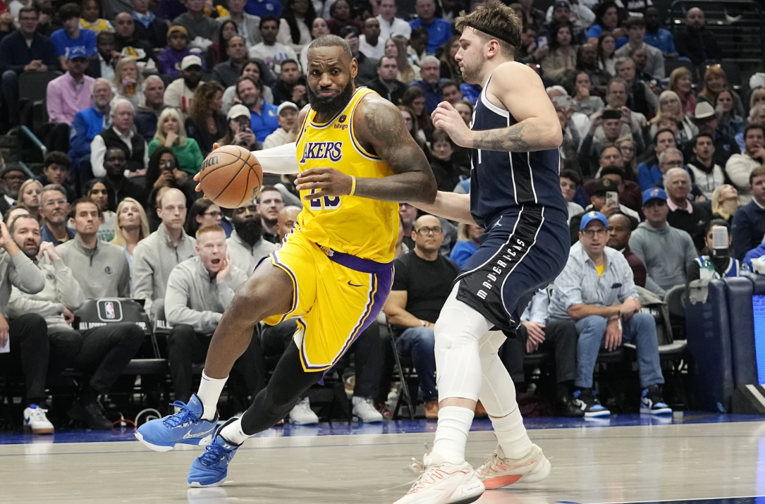Los Angeles Lakers forward LeBron James (23) drives against Dallas Mavericks guard Luka Doncic during the second half of an NBA game in Dallas, Tuesday.
