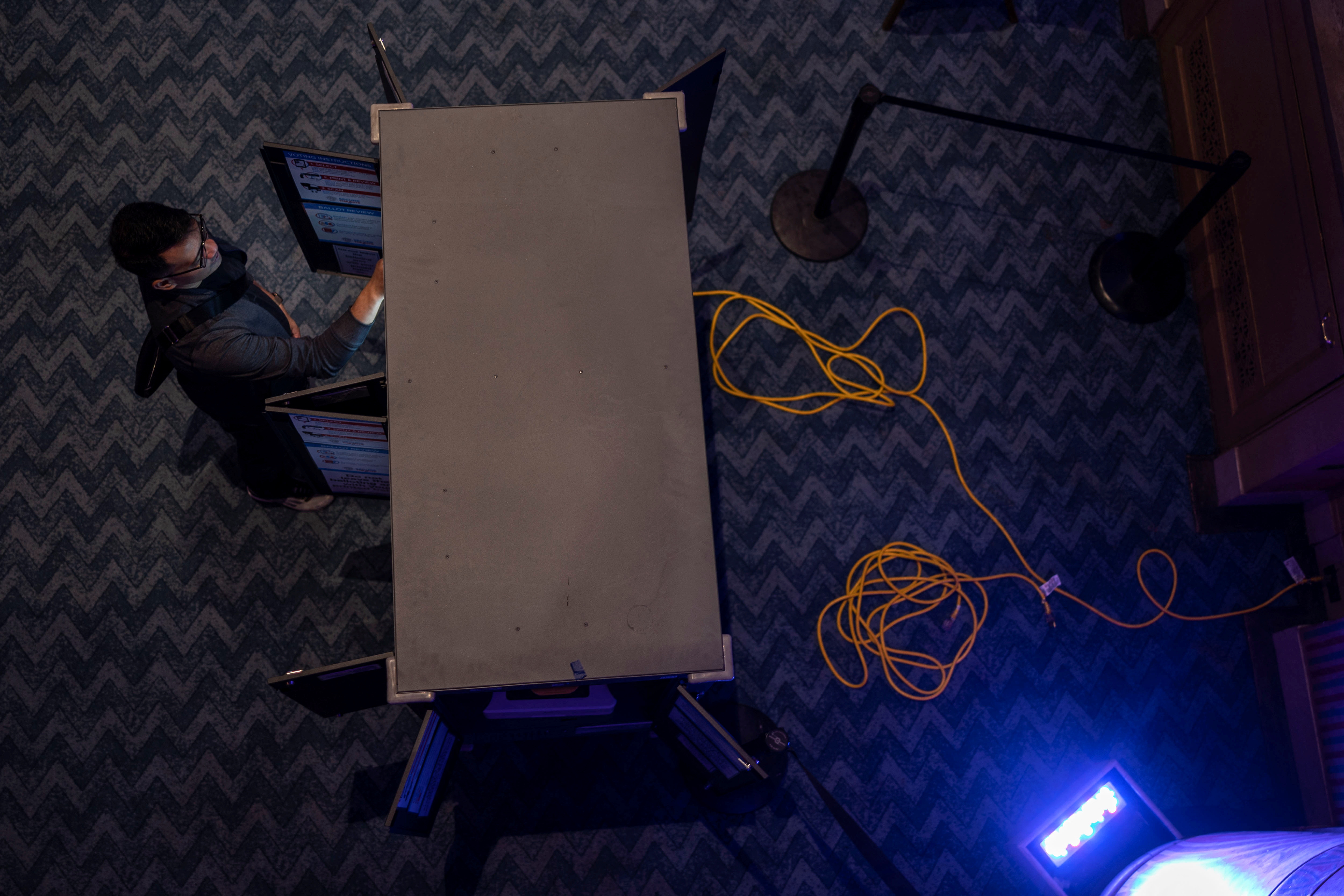 A local resident casts his ballot using Dominion Voting System machines during the midterm elections at the Fox Theater in downtown Atlanta, Georgia, U.S., November 8, 2022. 