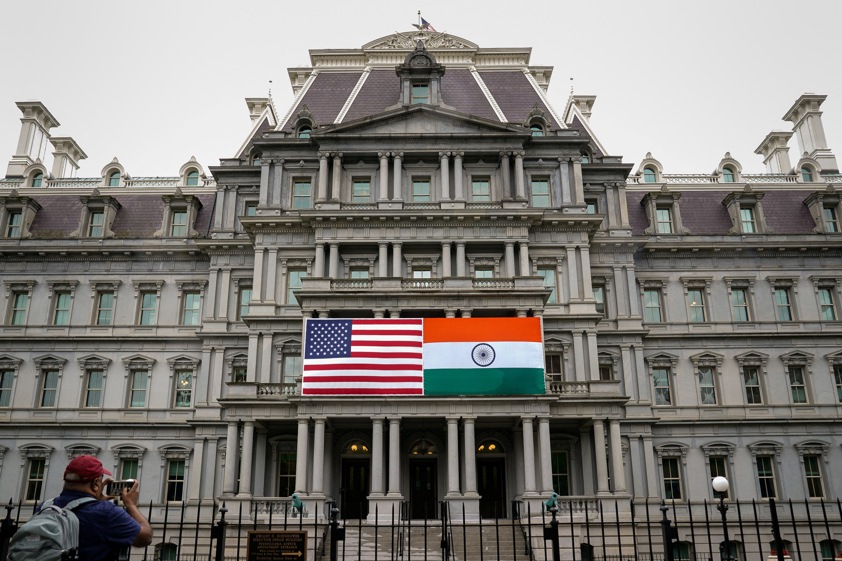 The flags of the United States and India are displayed on the Eisenhower Executive Office Building at the White House in Washington, U.S., June 21, 2023. 