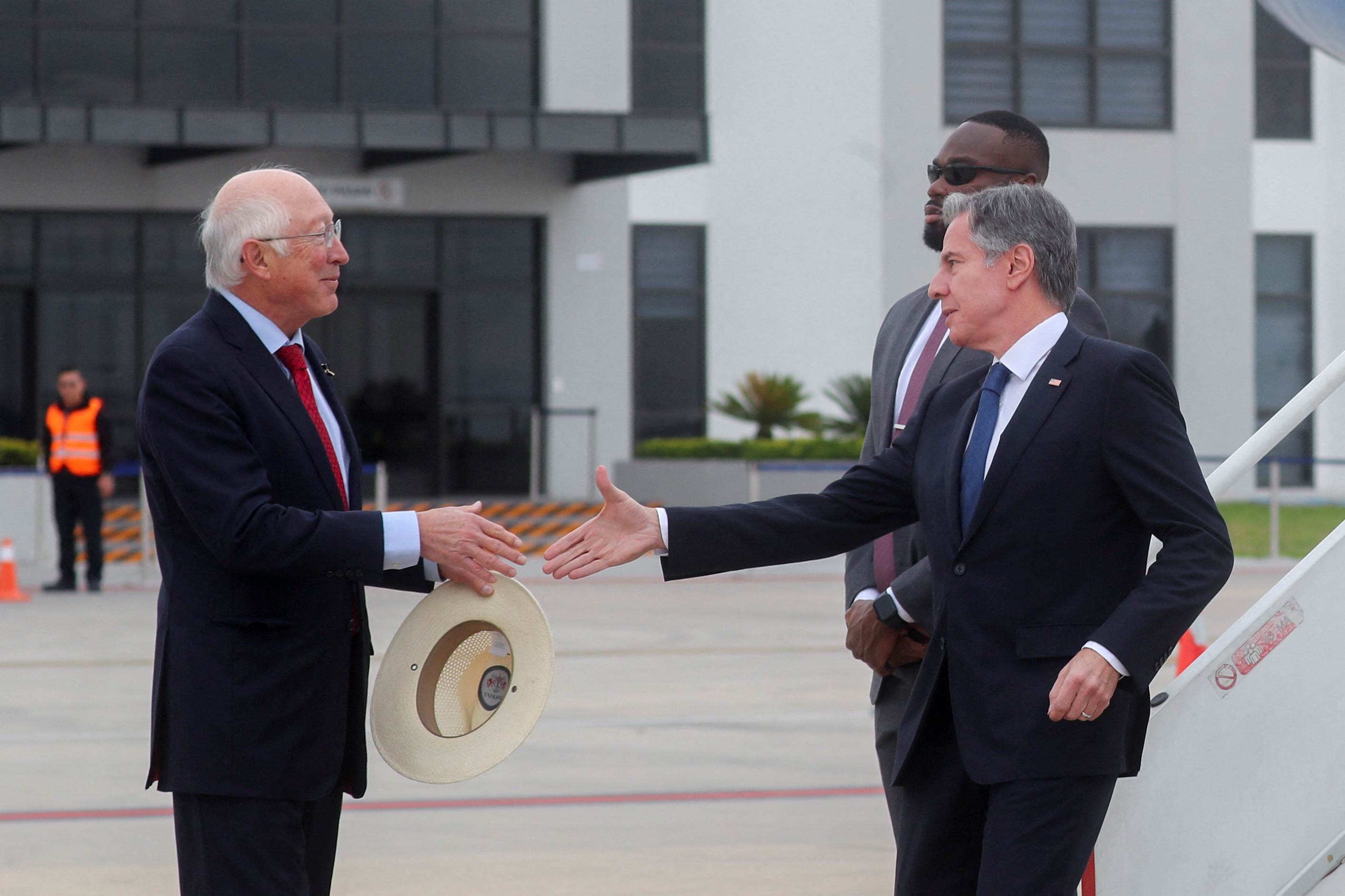 U.S. Ambassador to Mexico Ken Salazar greets U.S. Secretary of State Antony Blinken upon his arrival at Felipe Angeles International Airport in Zumpango, Mexico December 27, 2023