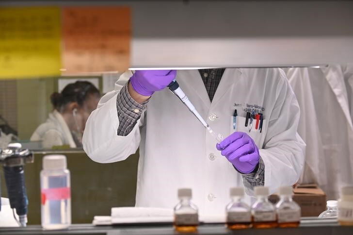A researcher works in Dr. John Tisdale's lab at the National Institutes of Health after the agency announced a breakthrough in sickle cell anemia research in Bethesda, U.S. March 11, 2019. 