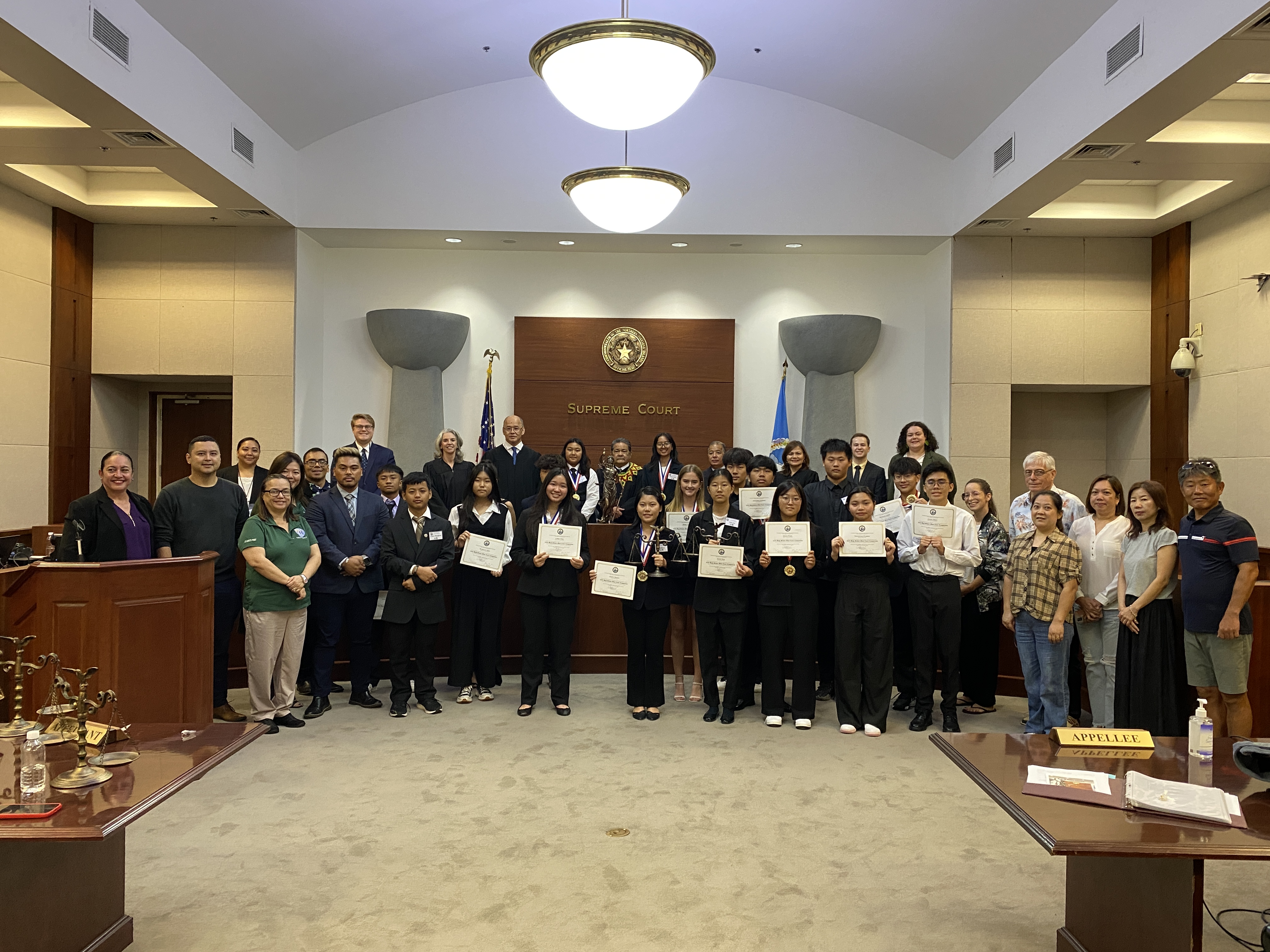 Competitors, justices, judgers judiciary and Public School System staff pose at the conclusion of the 2023 High School Moot Court Competition on Thursday at Guma Hustisia.