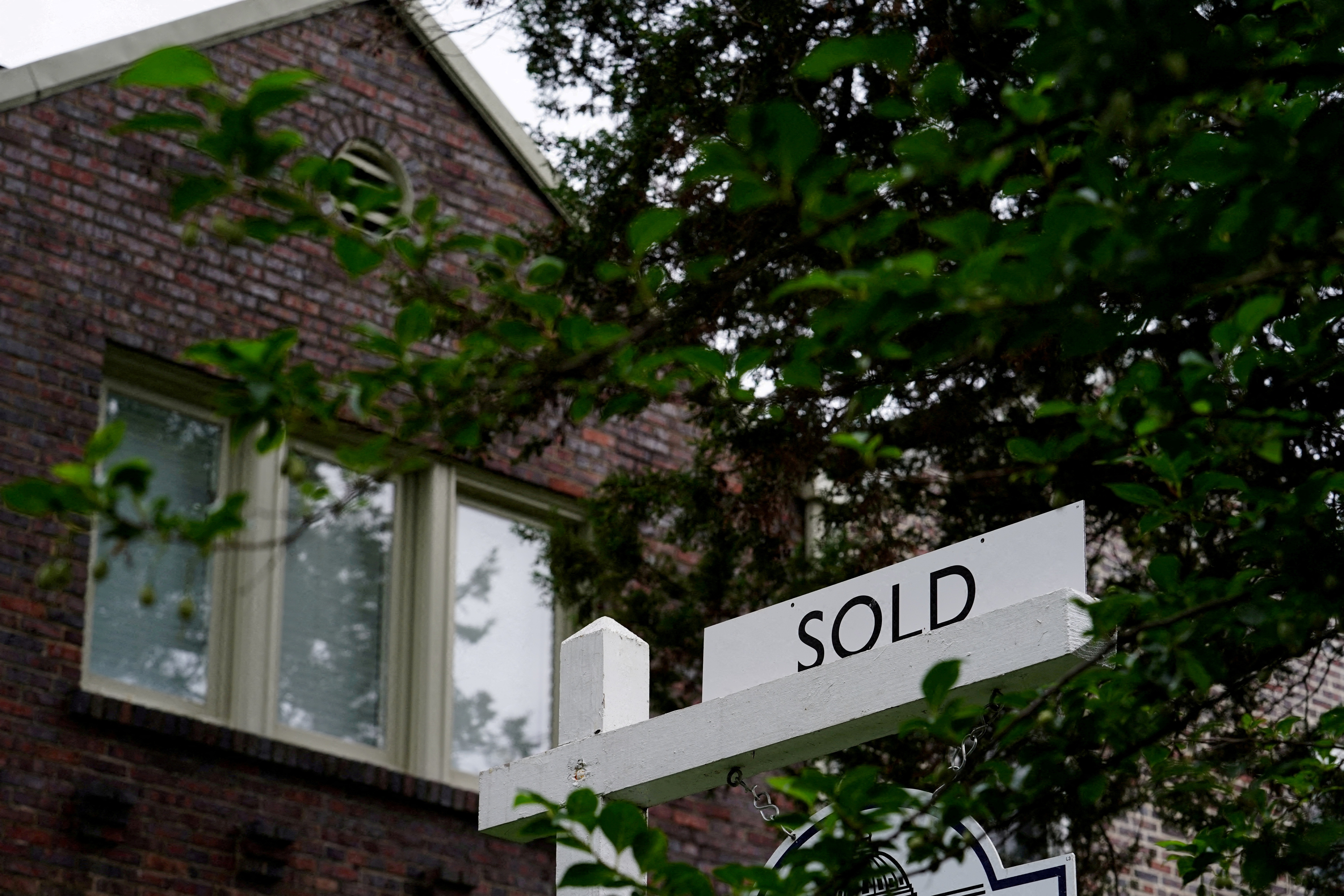 A "sold" sign is seen outside of a recently purchased home in Washington, U.S., July 7, 2022. 
