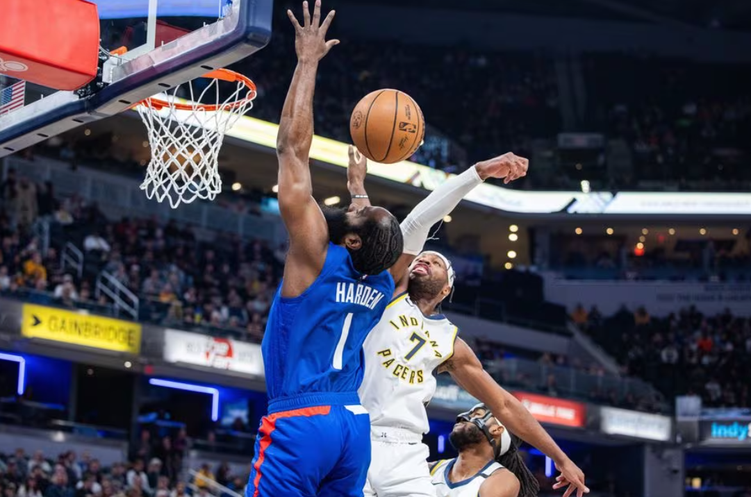 LA Clippers guard James Harden (1) shoots the ball while Indiana Pacers guard Buddy Hield (7) defends in the first quarter at Gainbridge Fieldhouse in Indianapolis, Indiana, Dec. 18, 2023.